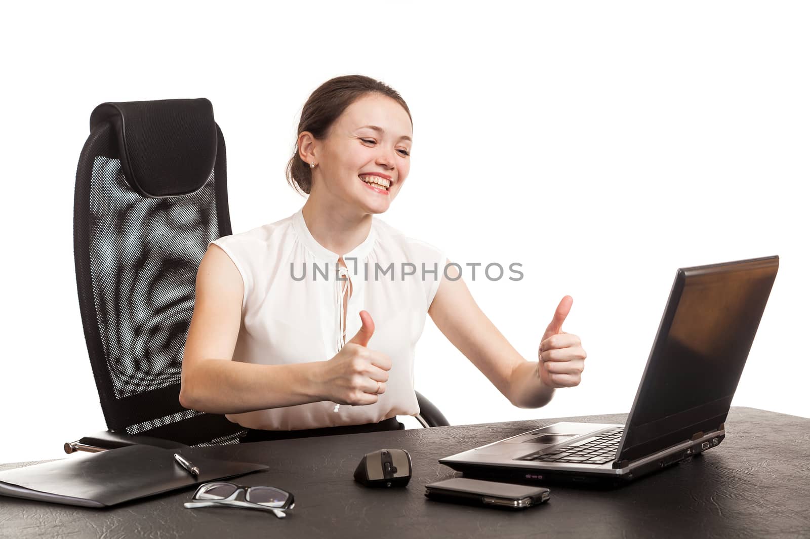 the business woman sits at office table with the laptop