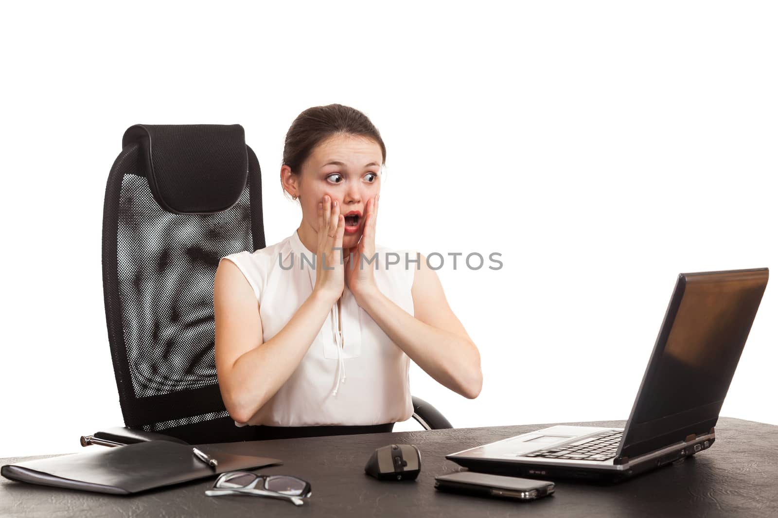 the business woman sits at office table with the laptop 