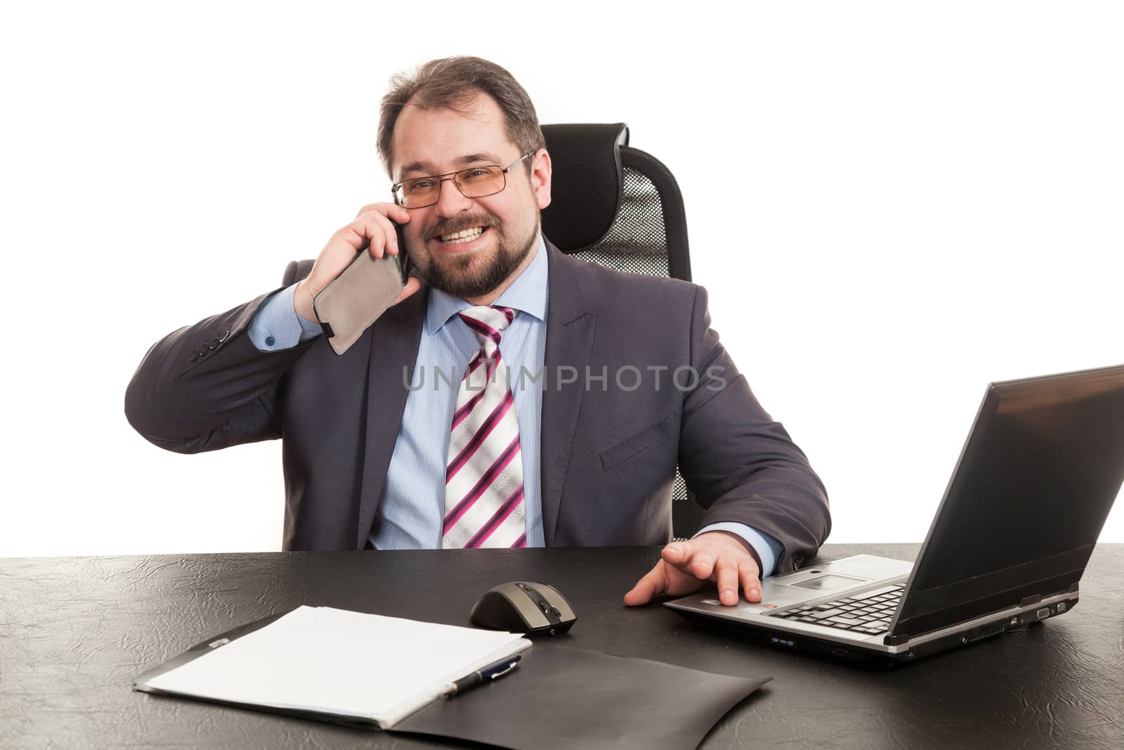 the businessman communicates by phone sitting at a table