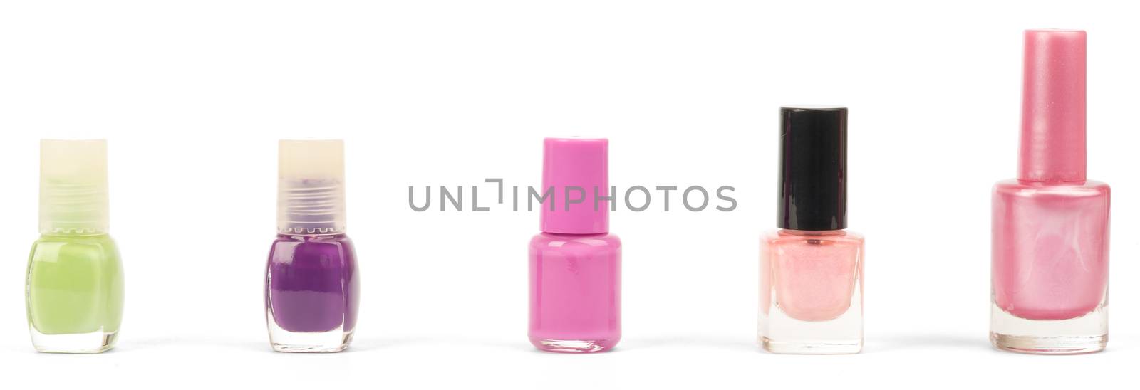 Colorful nail polishes isolated on white background