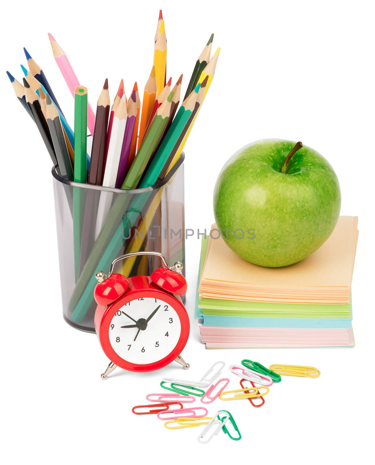 Alarm clock with apple, stickers and crayons isolated on white background