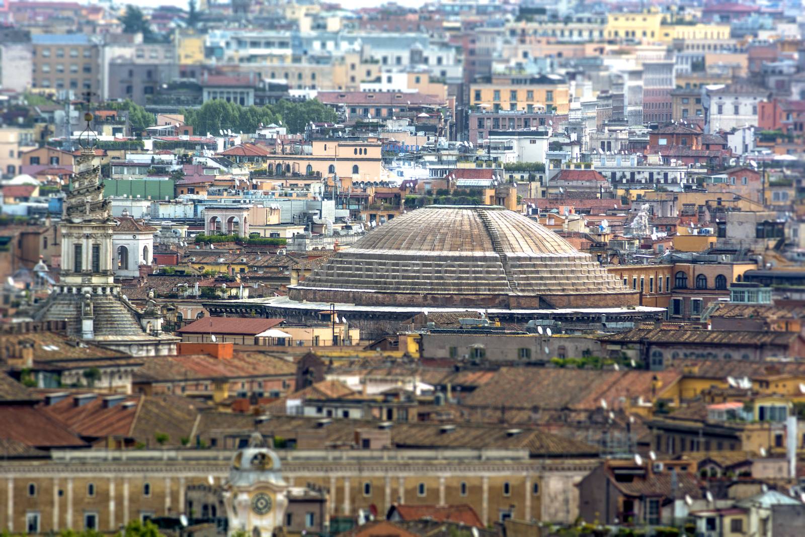 panoramic view on the roofs of Rome with the Pantheon dome in foreground