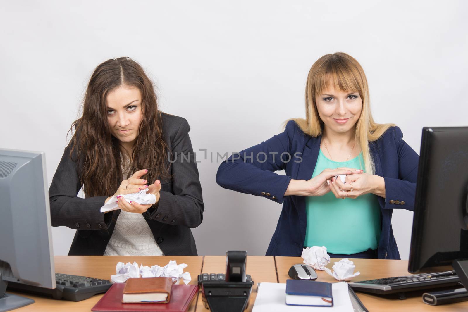 Employees of office paper crumpling up to something by Madhourse