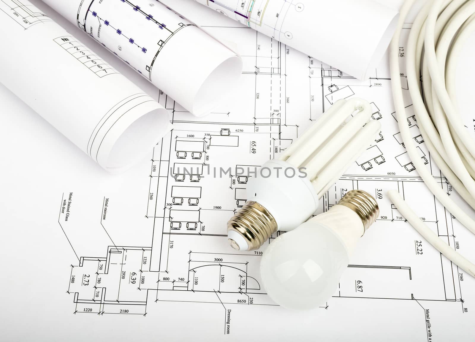 Architecture plan and rolls of blueprints with bulbs. Building concept
