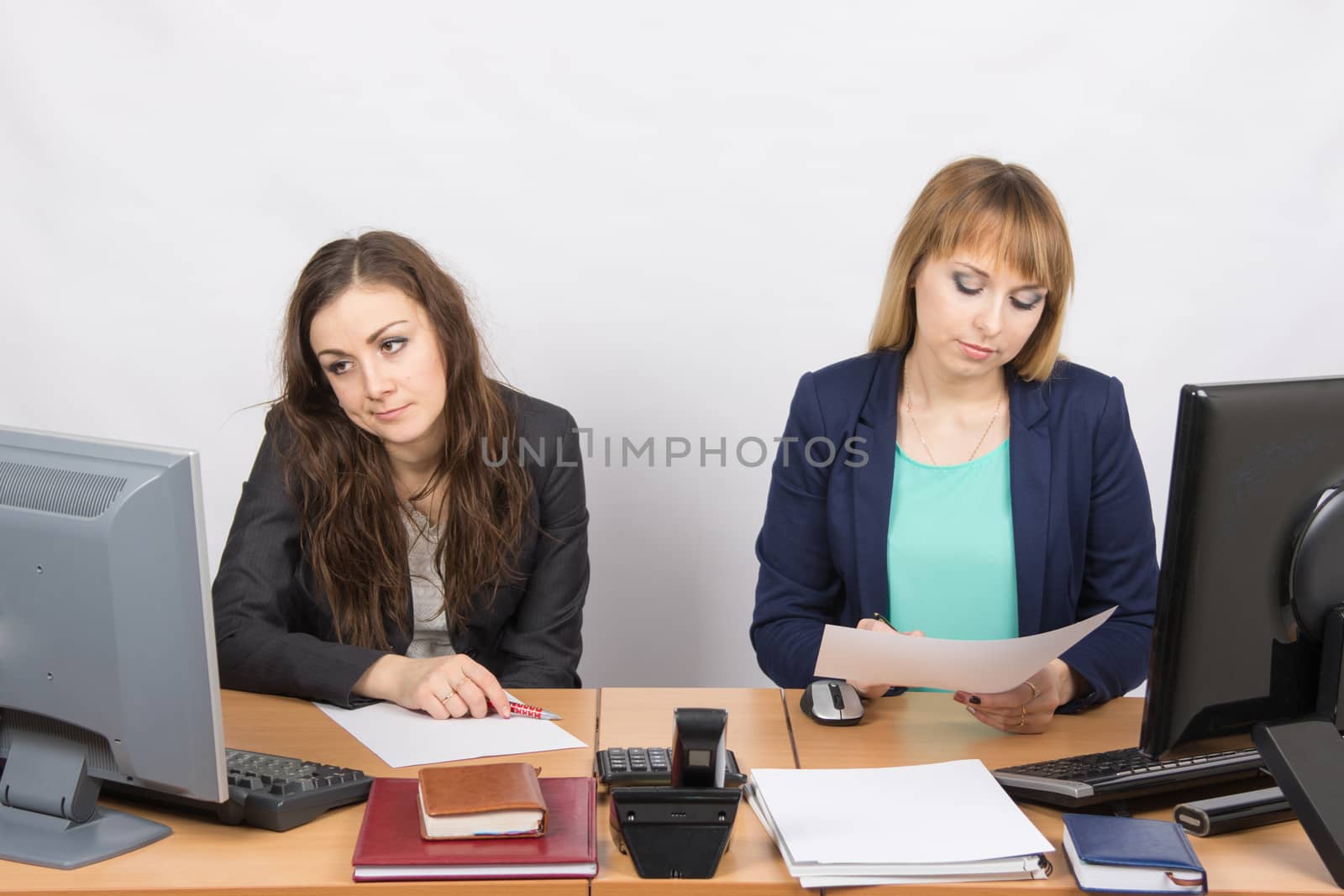 Office Workers of despondently sitting at a desk