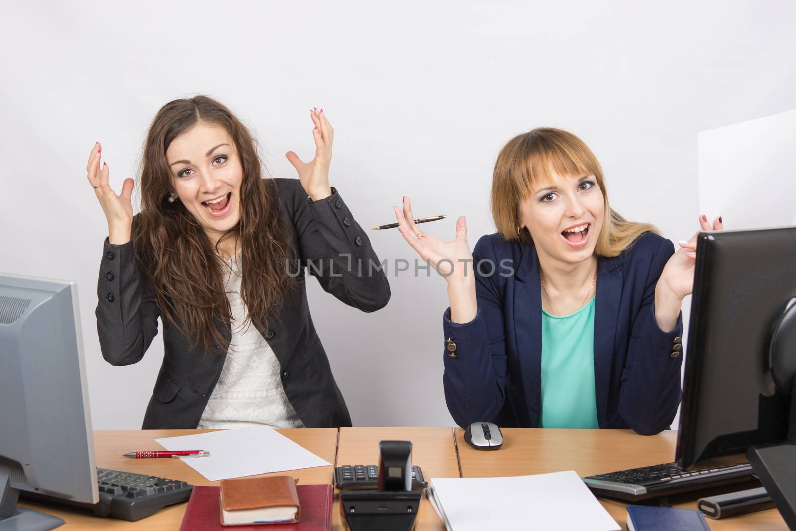 Two employee in the office expressed elation