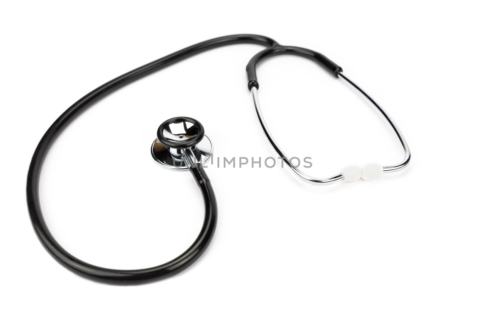 Black professional stethoscope lying isolated on white background