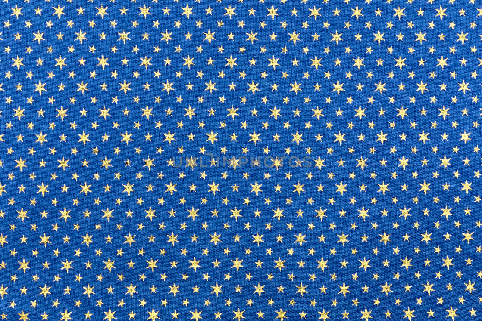 Blue fabrics with golden stars for christmas