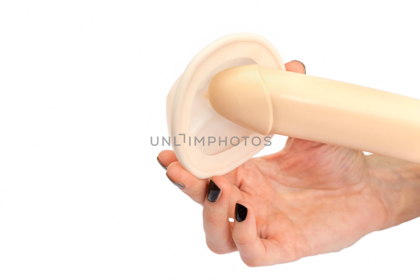 Hand of woman showing model of human penis and pessary isolated on white background