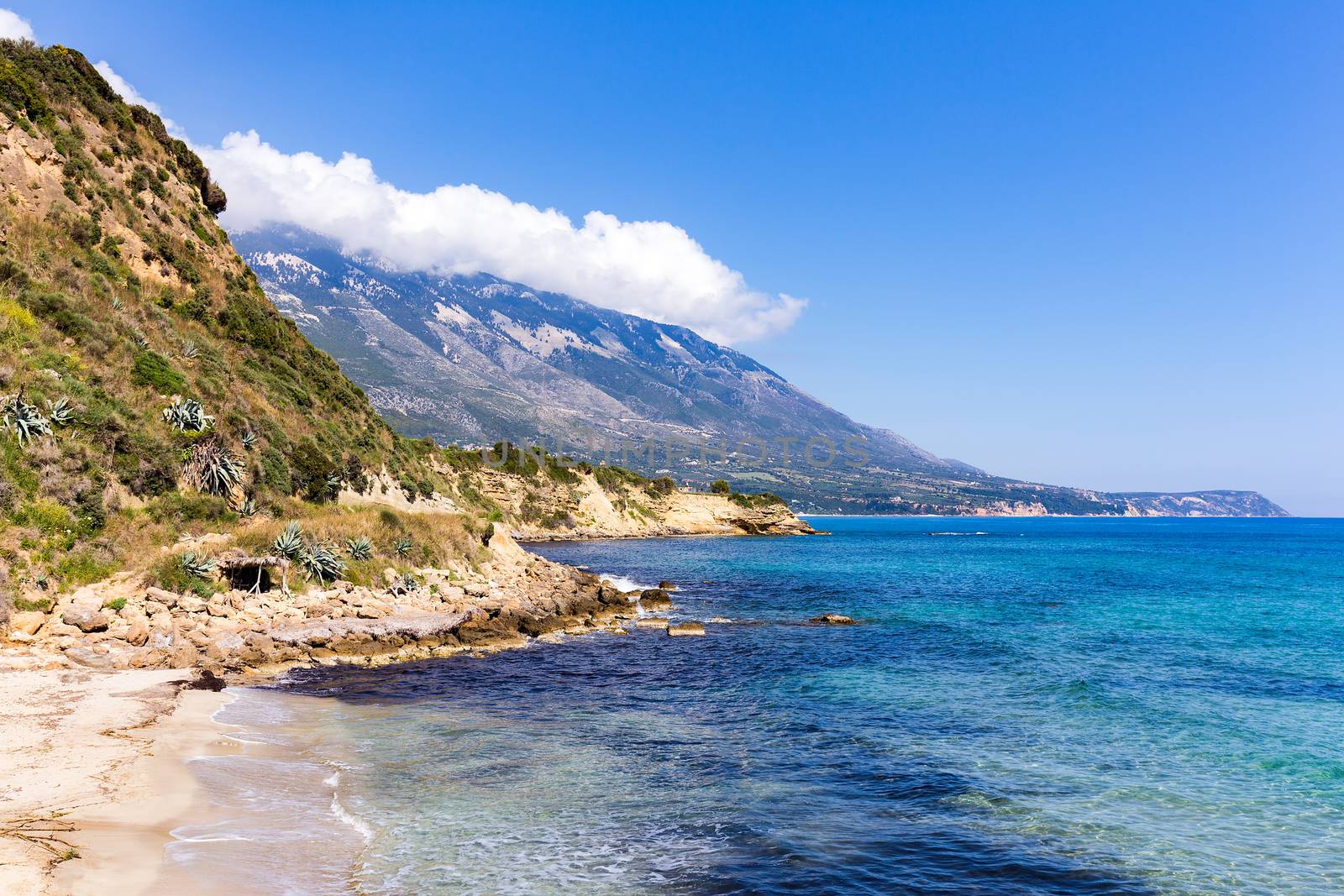 Mountains at coast  with blue sea in Kefalonia Greece by BenSchonewille
