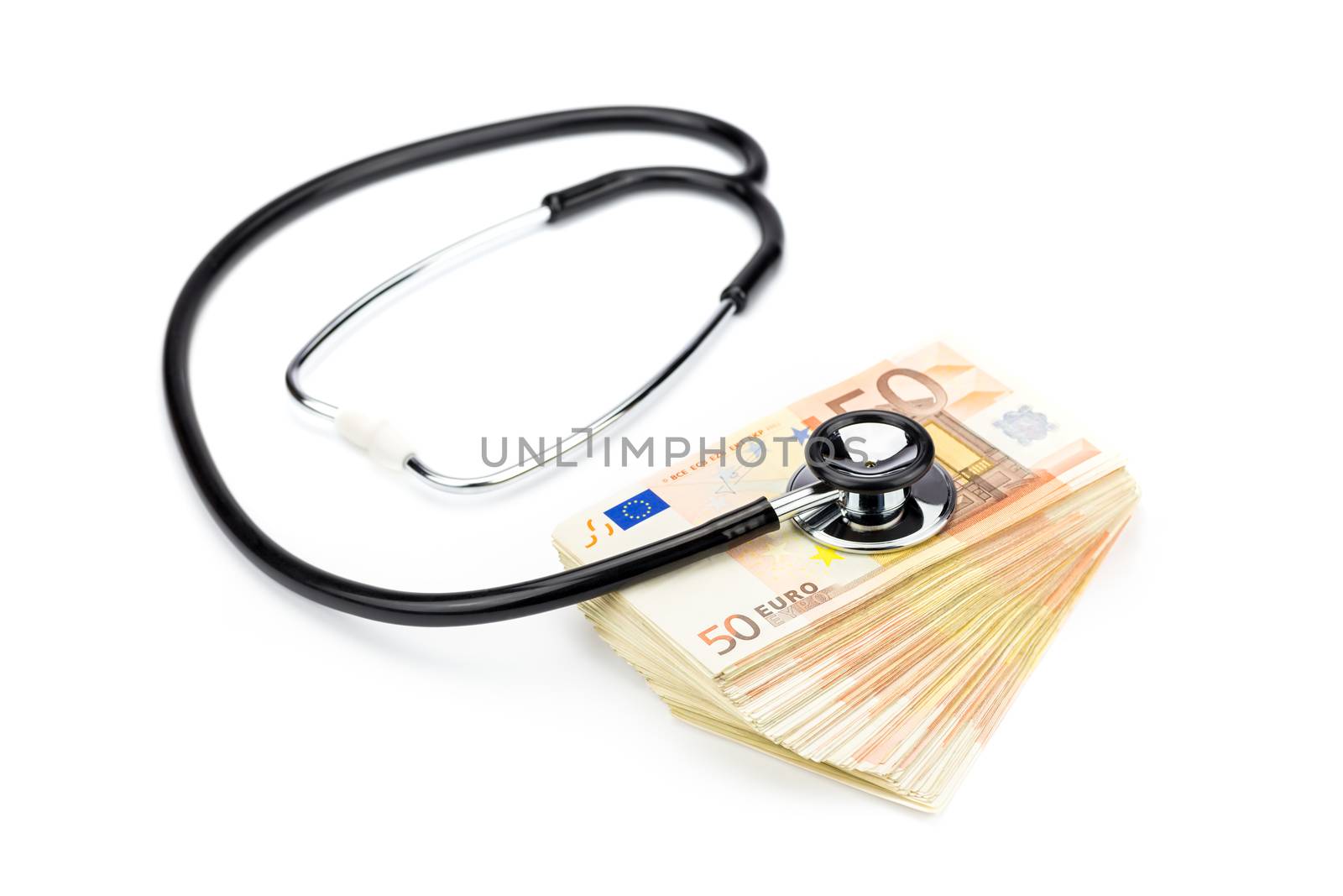 Professional stethoscope lying on pile of euro bills isolated on white background