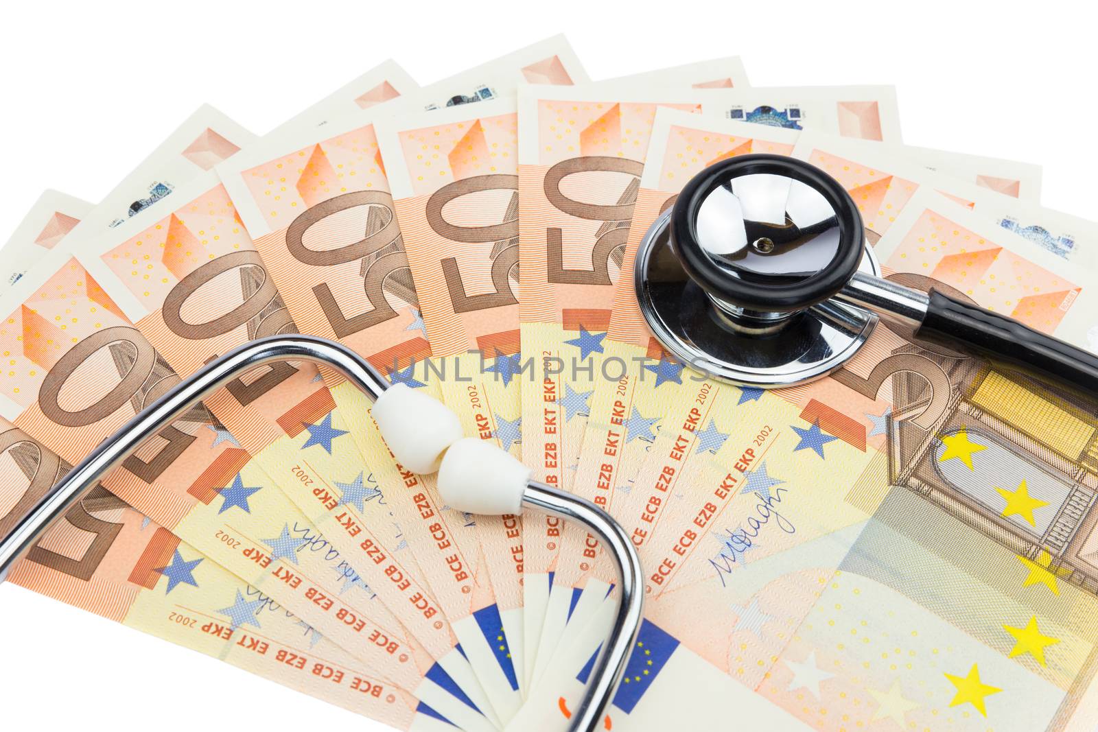 Professional stethoscope lying on pile of euro notes isolated on white background