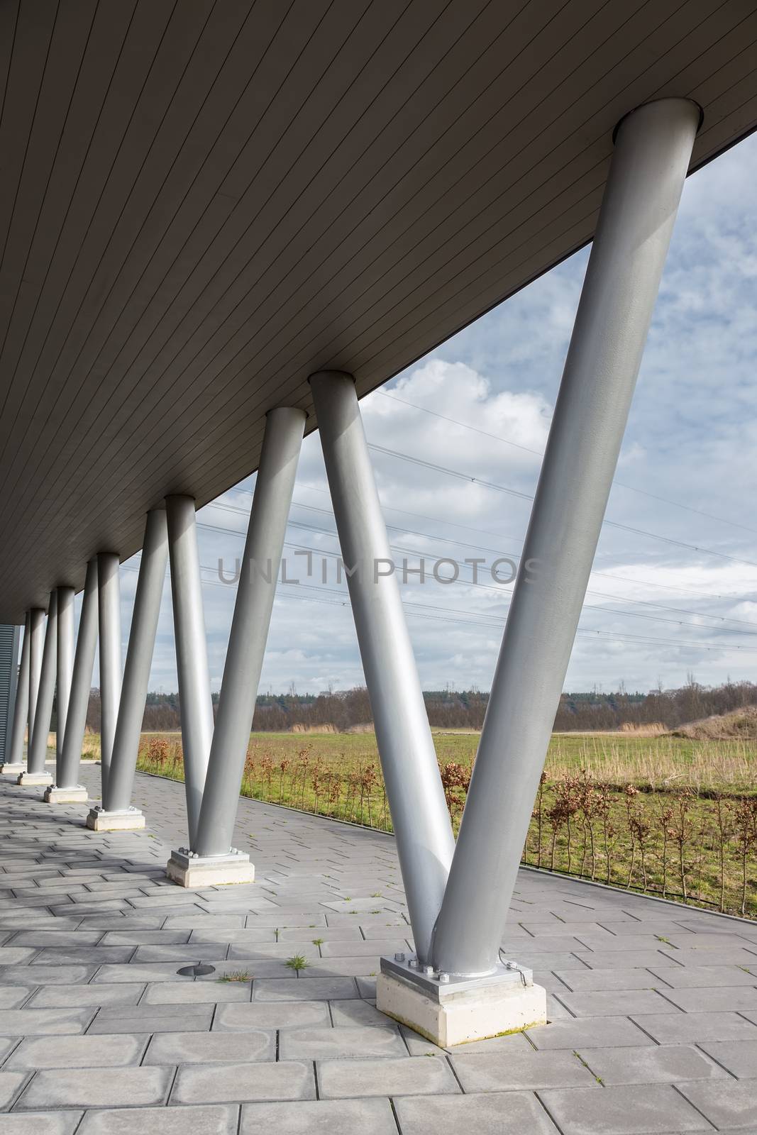 V- shaped metal pillars as construction under roof of building