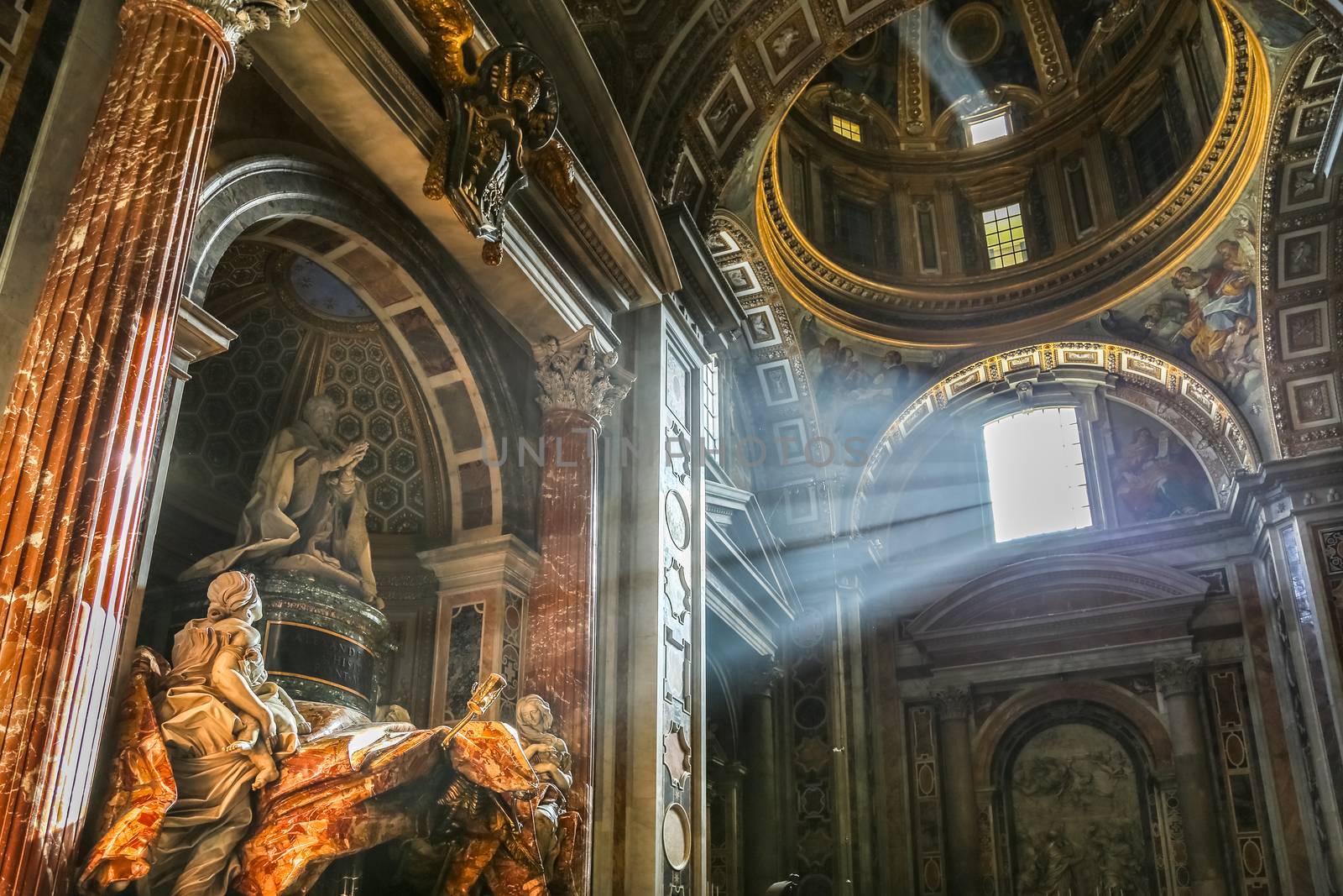 Vatican, Italy - June 26, 2014: The sun's rays pour at the interior of the Saint Peter Cathedral in Vatican. 