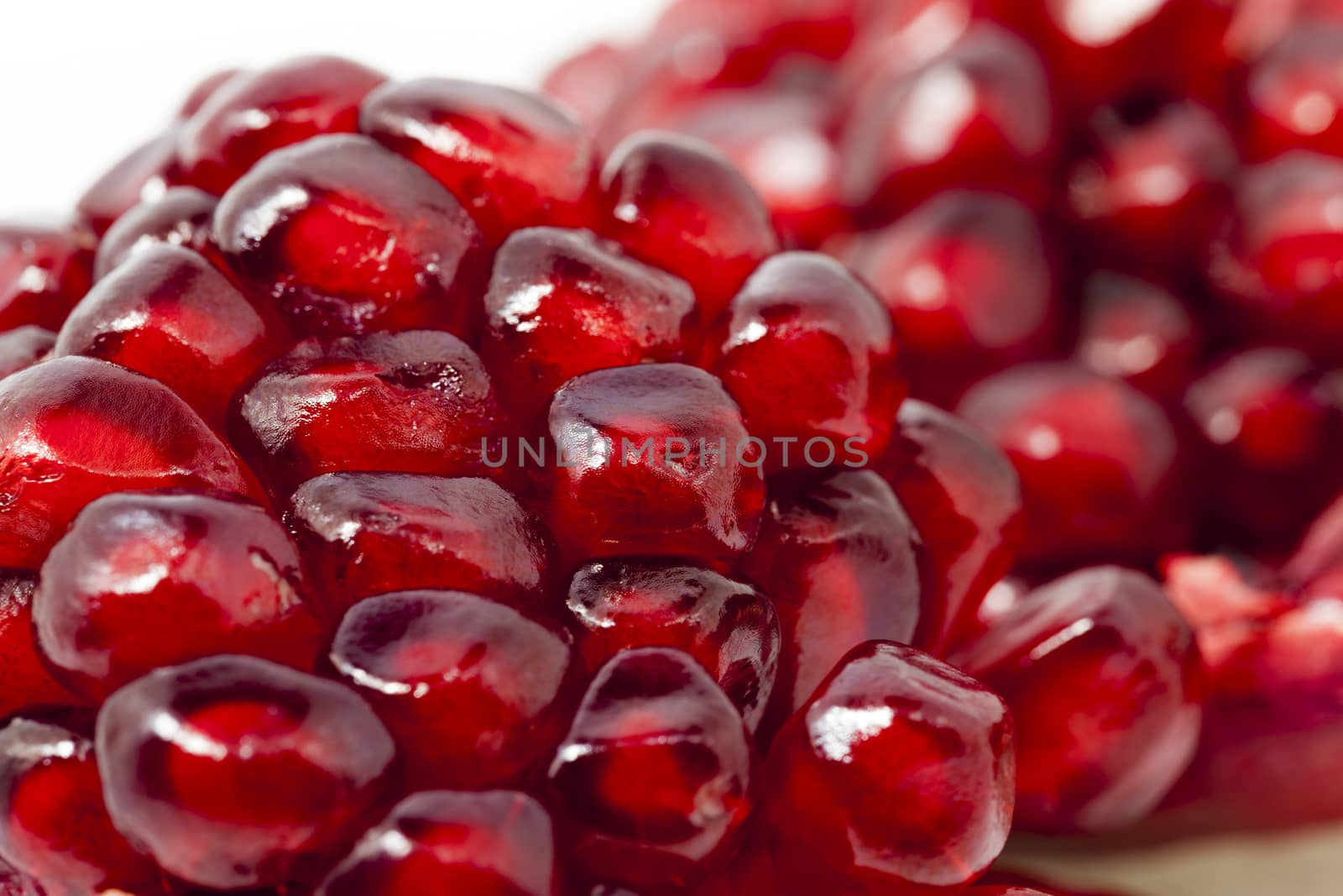  photographed close up ripe red pomegranate seeds