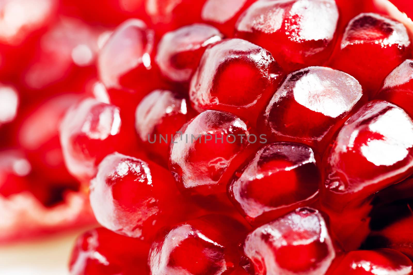 photographed close up ripe red pomegranate seeds