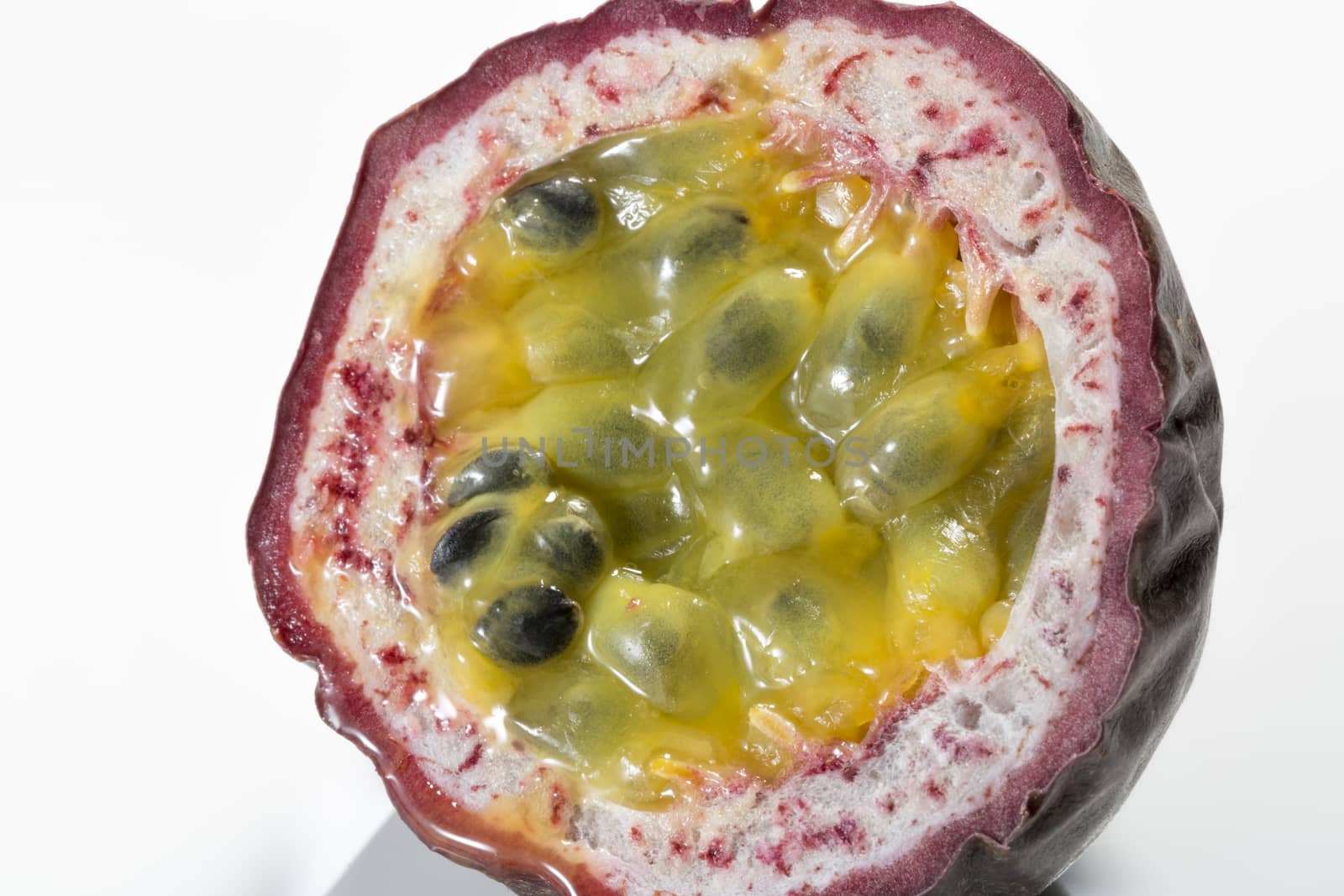 Passion Fruit Cross Section Close up on white background.