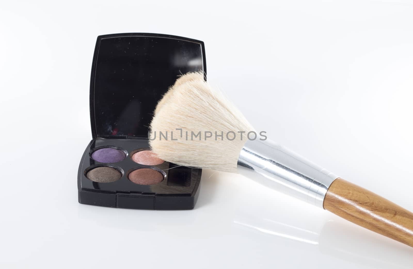 makeup eyeshadow with brush isolated on white background