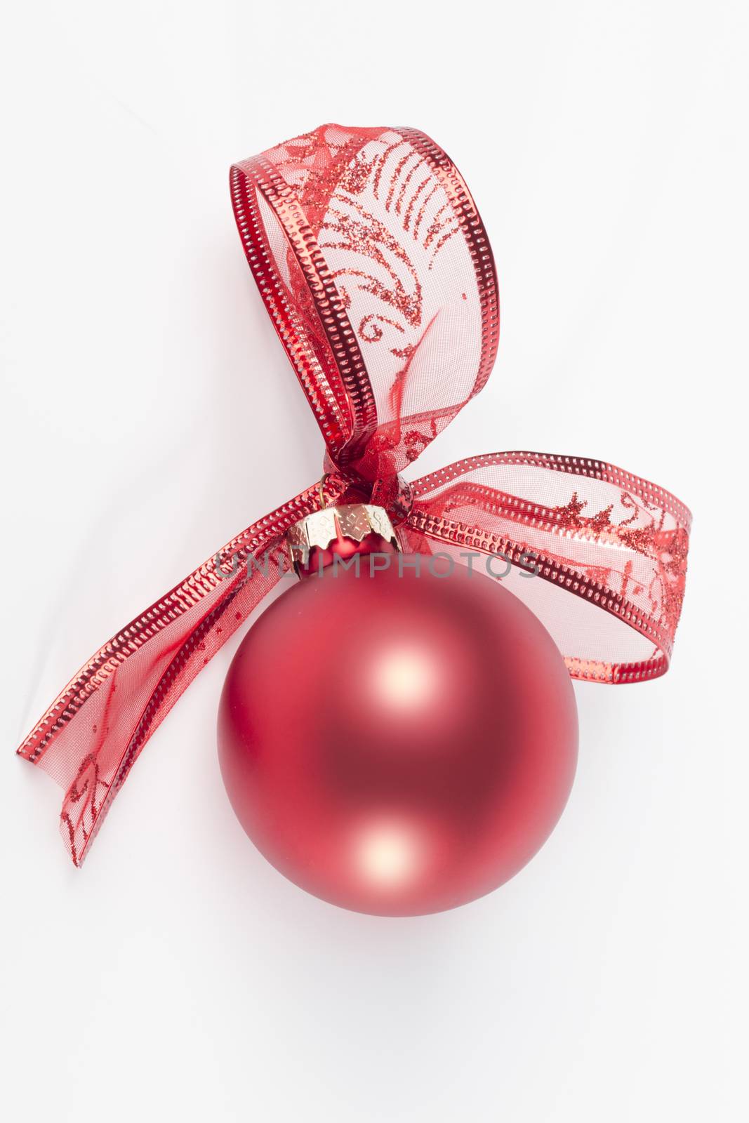 Red christmas ball with ribbon bow, isolated on white background by avanheertum