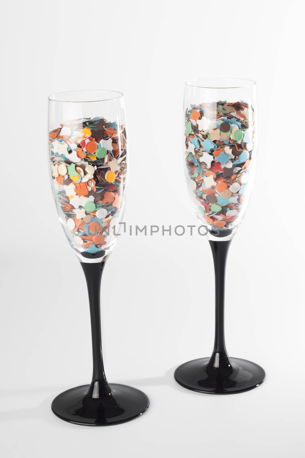 Champaing glasse with confetti, isolated on white background