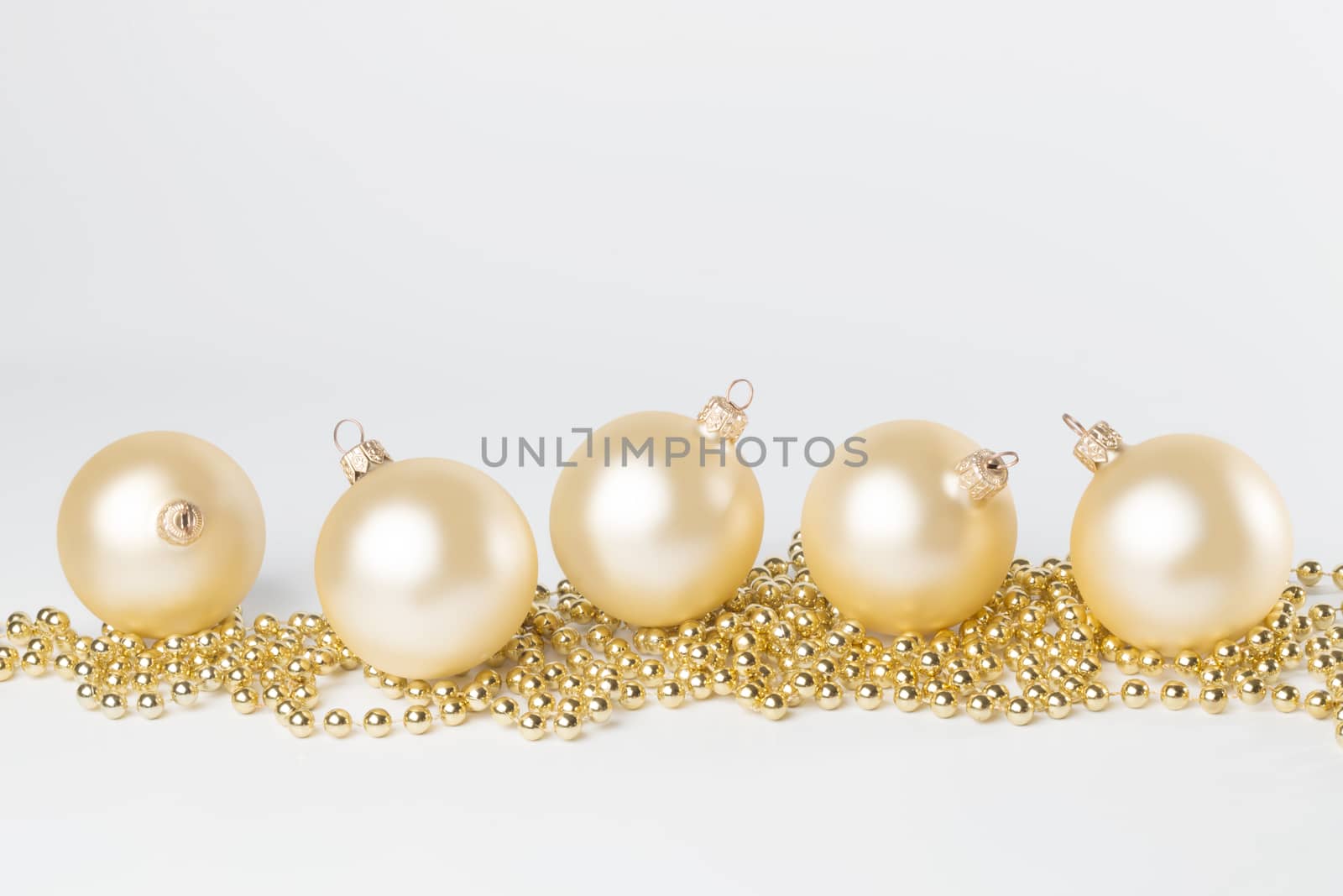 Golden, yellow Christmas balls, isolated on white background