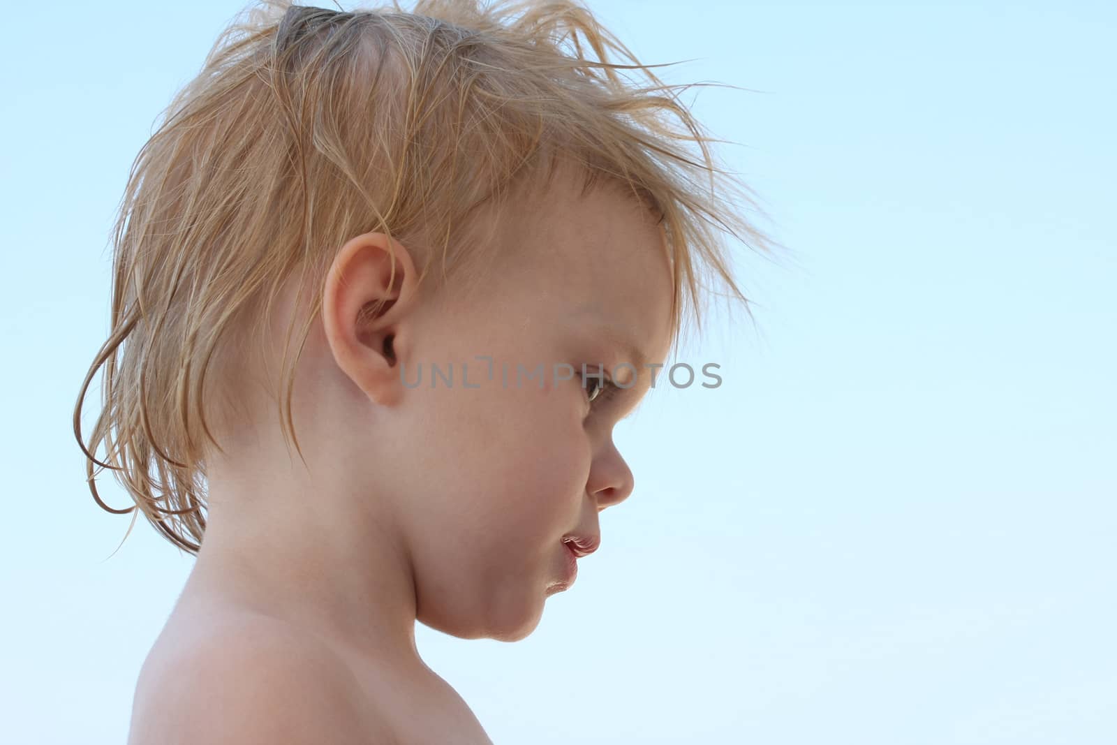 Portrait of cute baby girl with wet hair
