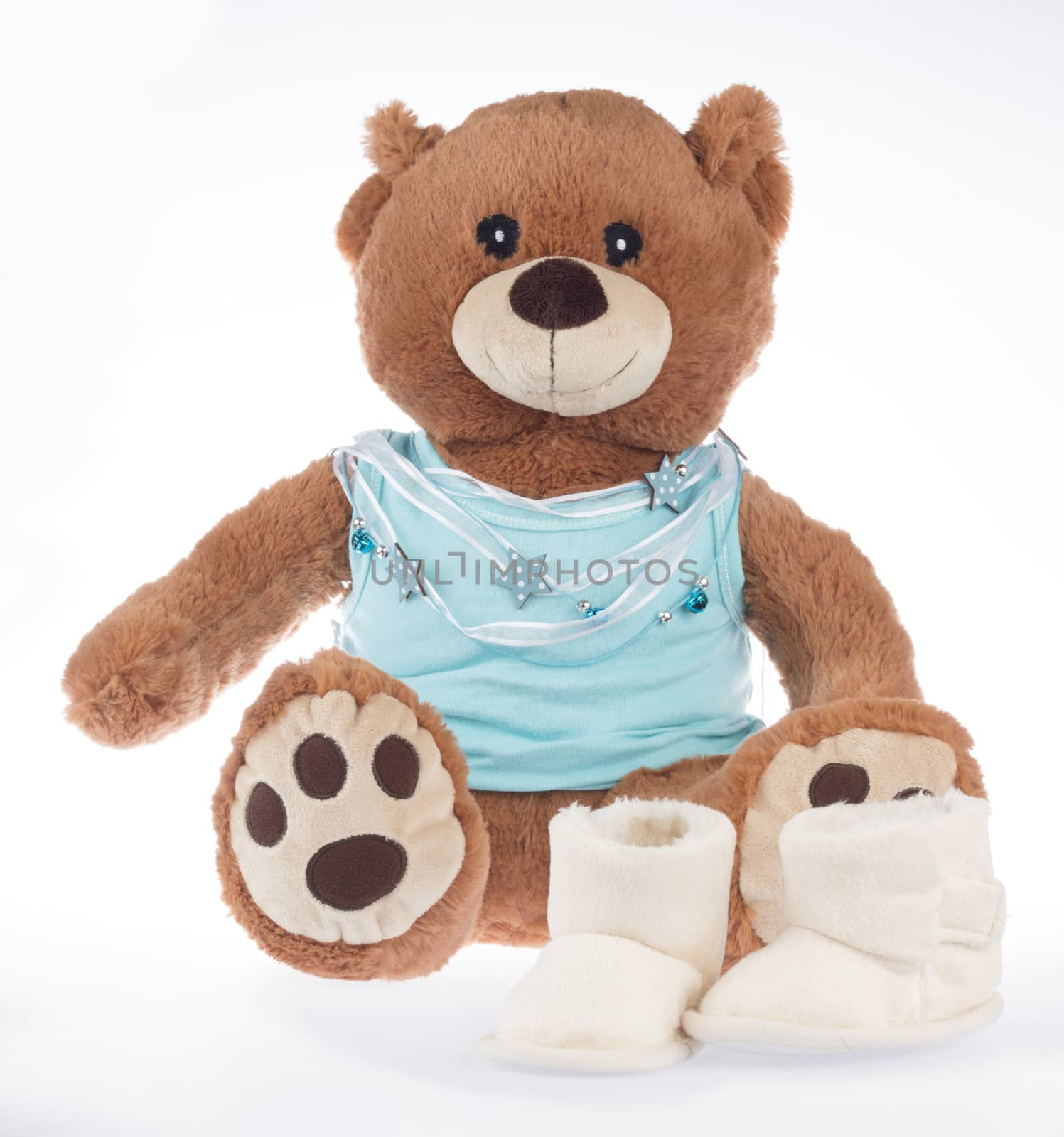 Teddy bear with blue shirt and ribbon and shoes, isolated on white background