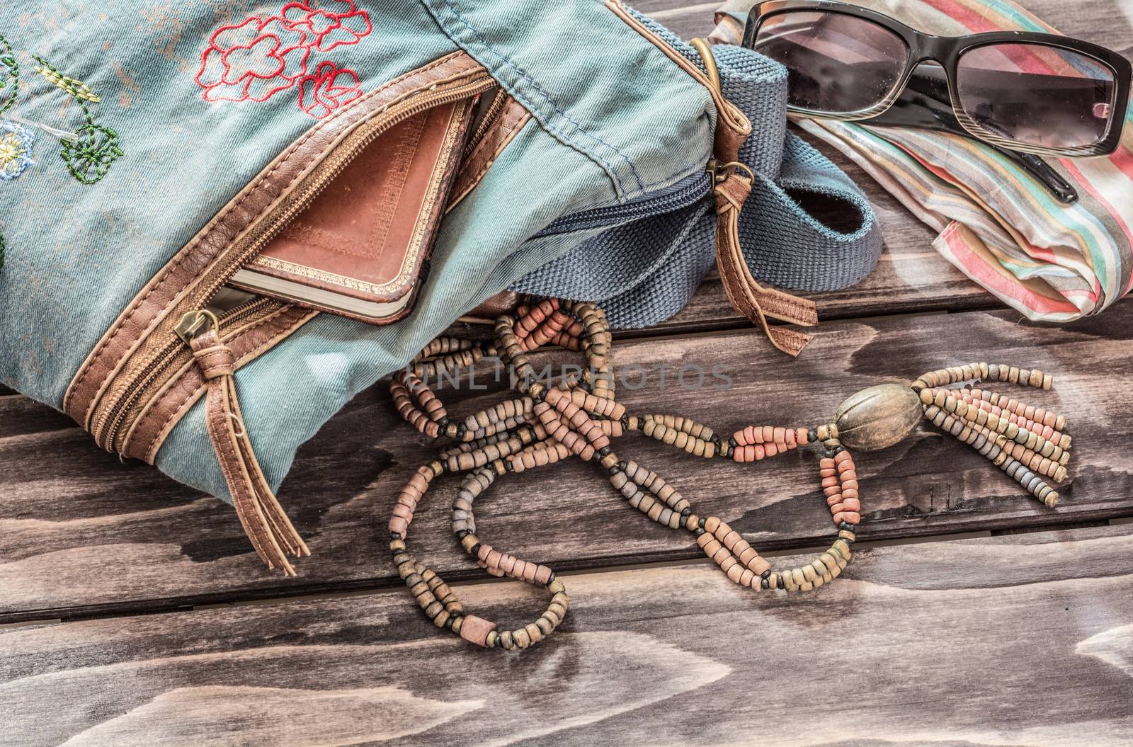 Vinatage still life of random objects of modern woman on wooden board
