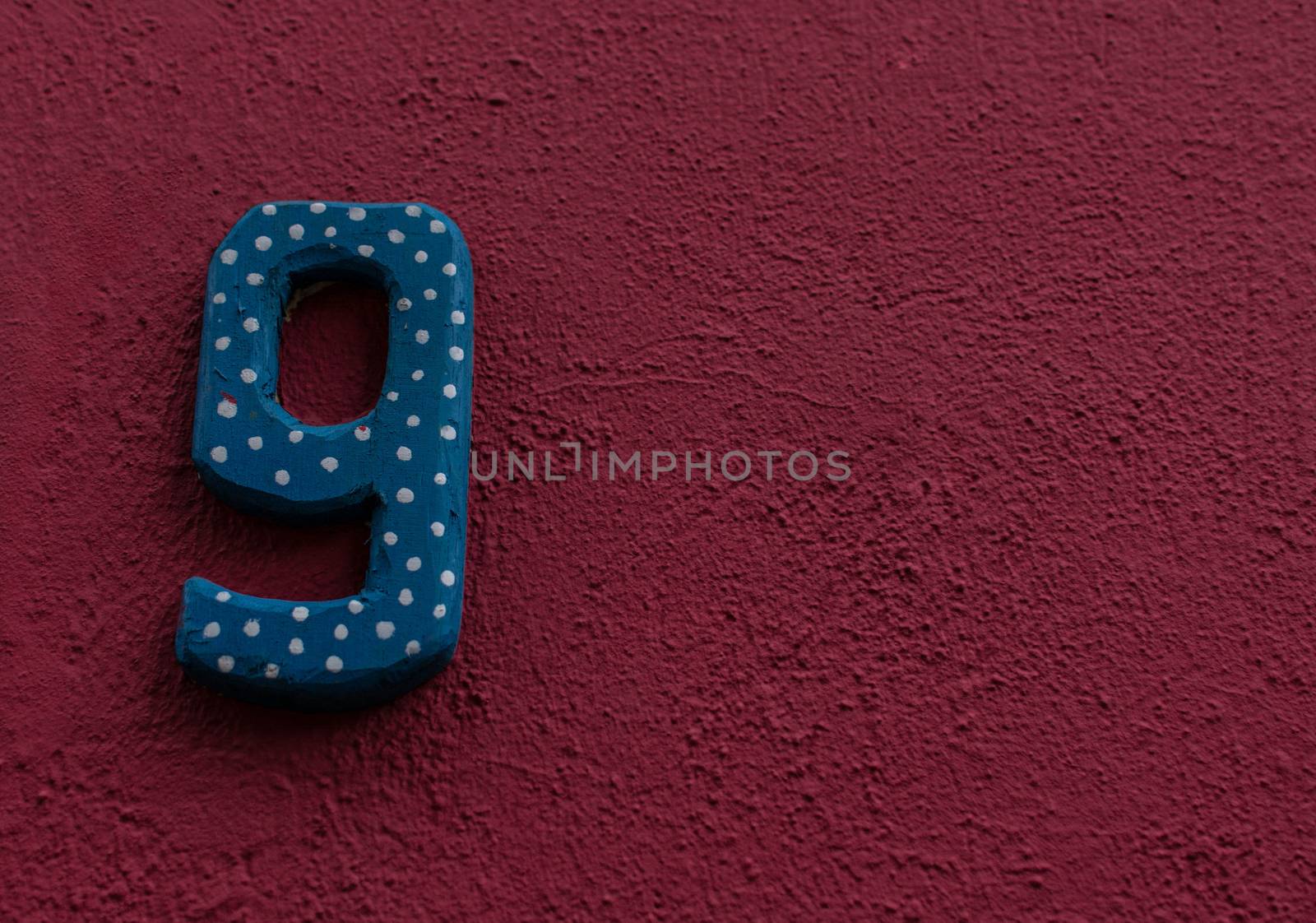 Funny number 9 on a house wall