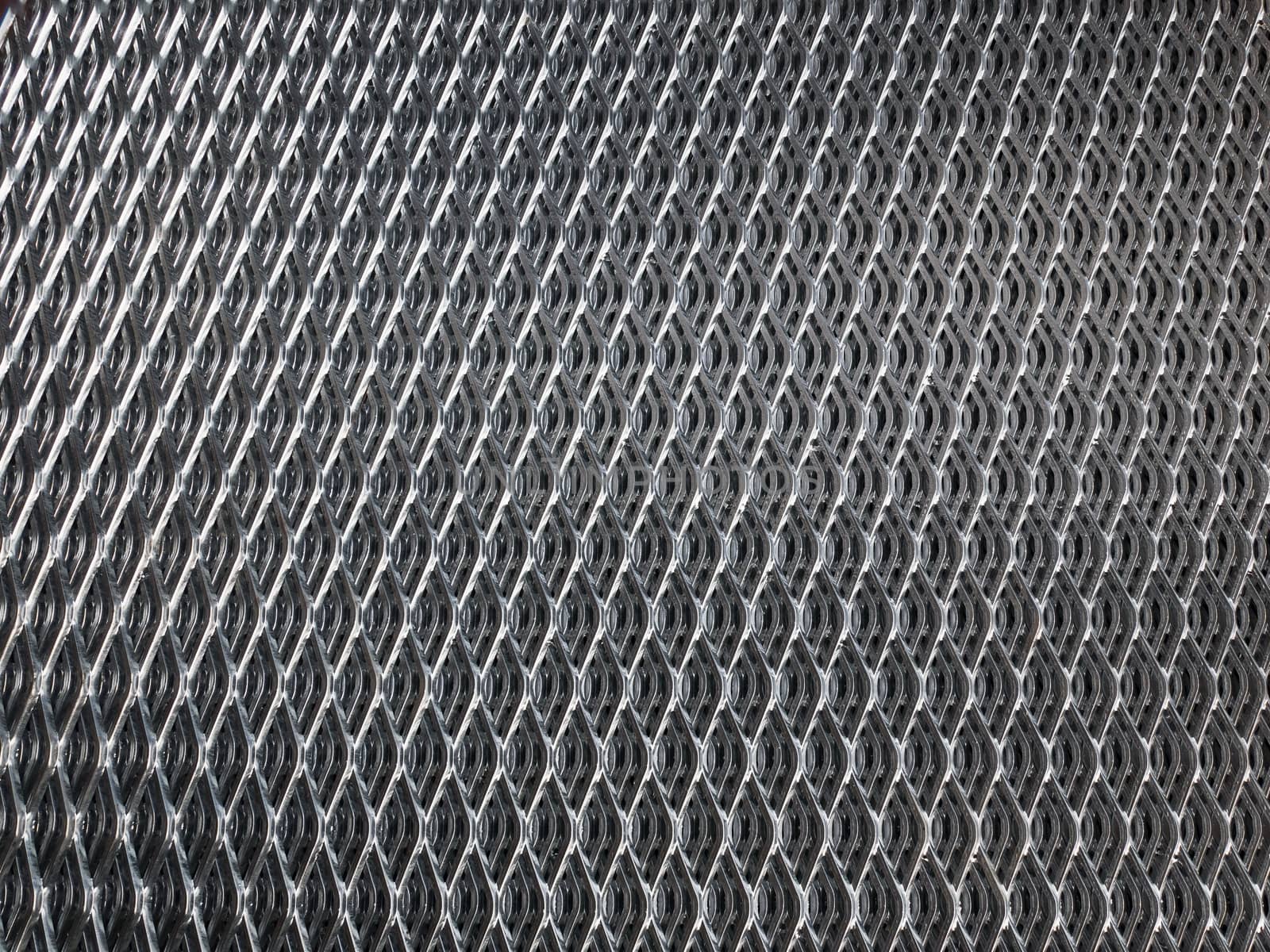 Shiny, galvanised industrial steel grid for use as background.