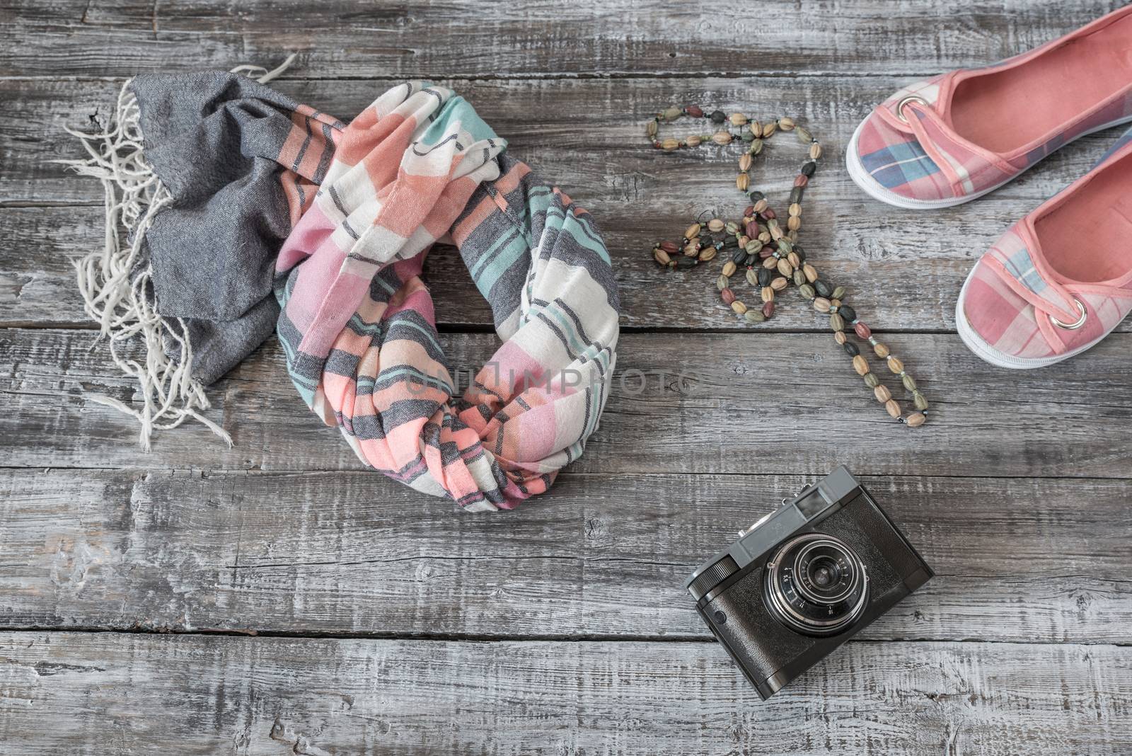 Vintage still life of random objects of modern woman on wooden board