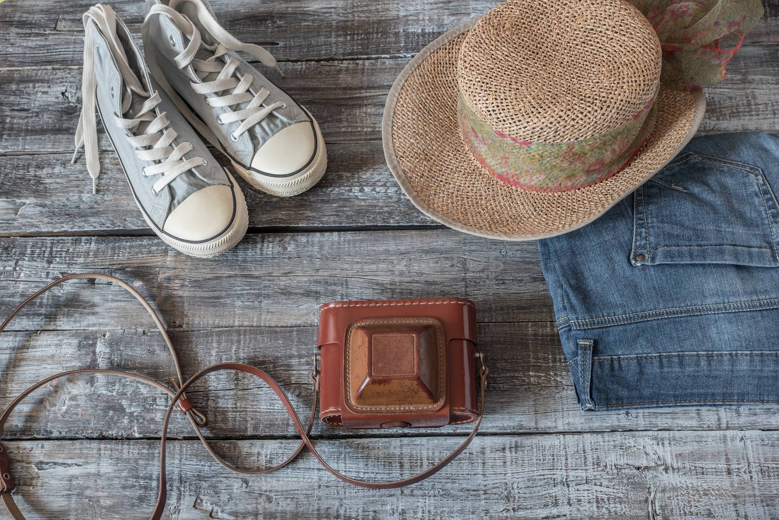 Vintage still life of random objects of modern woman on wooden board