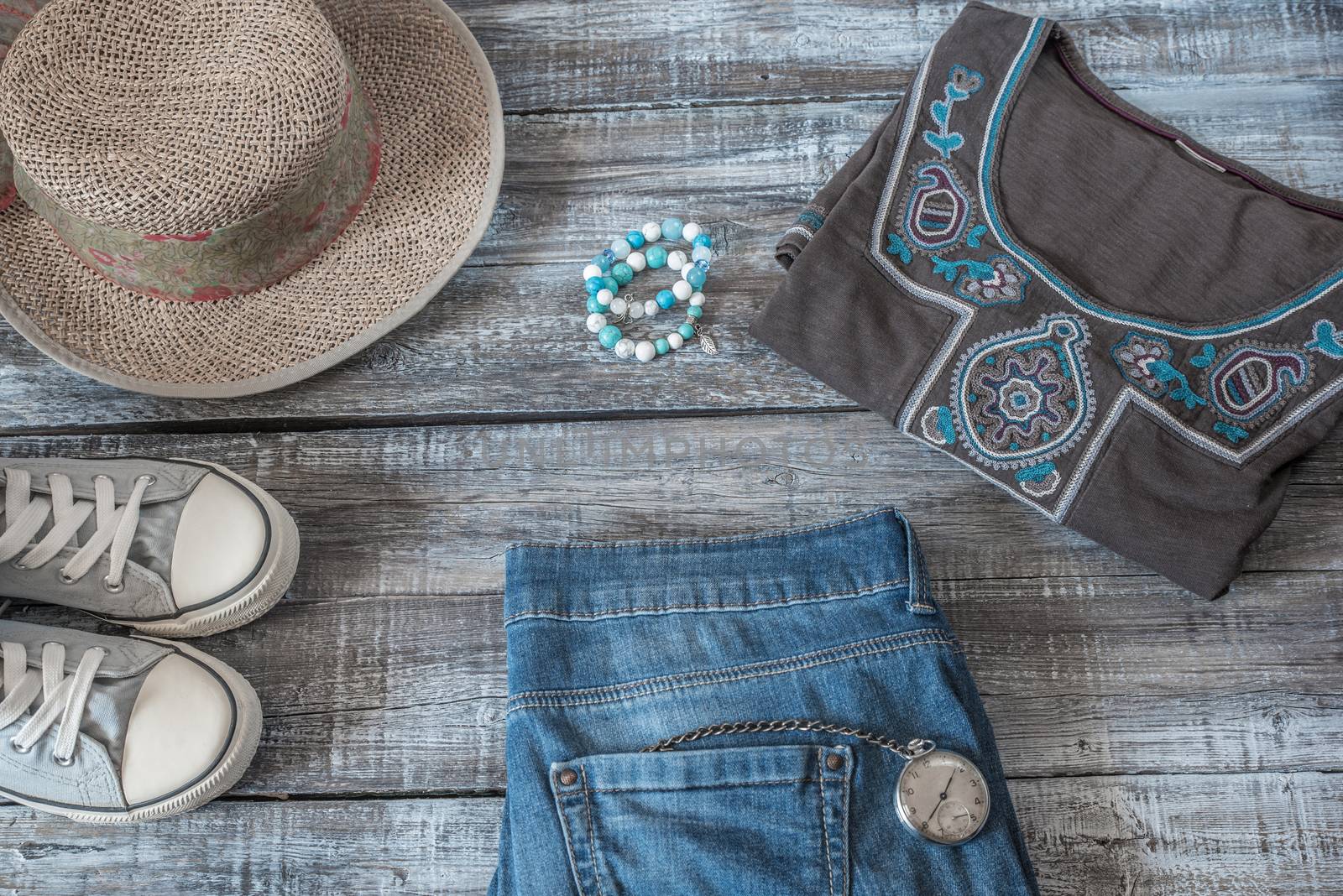 Vintage still life of random objects of modern woman on wooden board