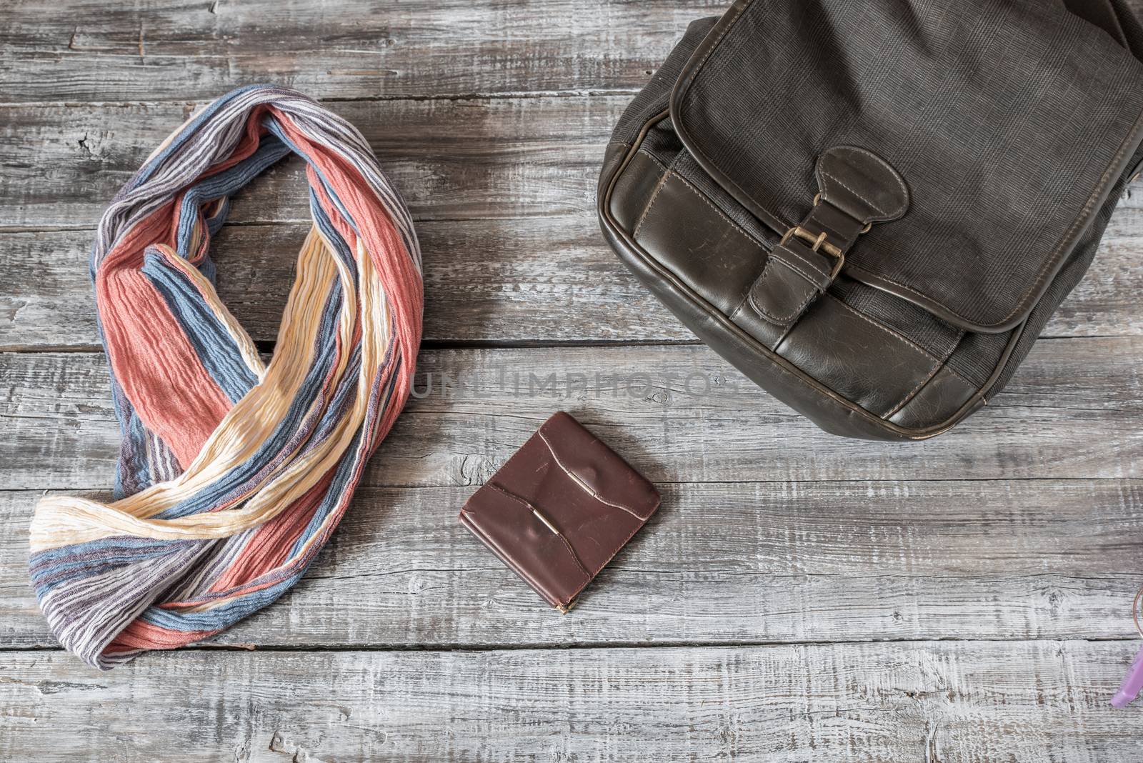 Vintage still life of random objects of modern woman on wooden board