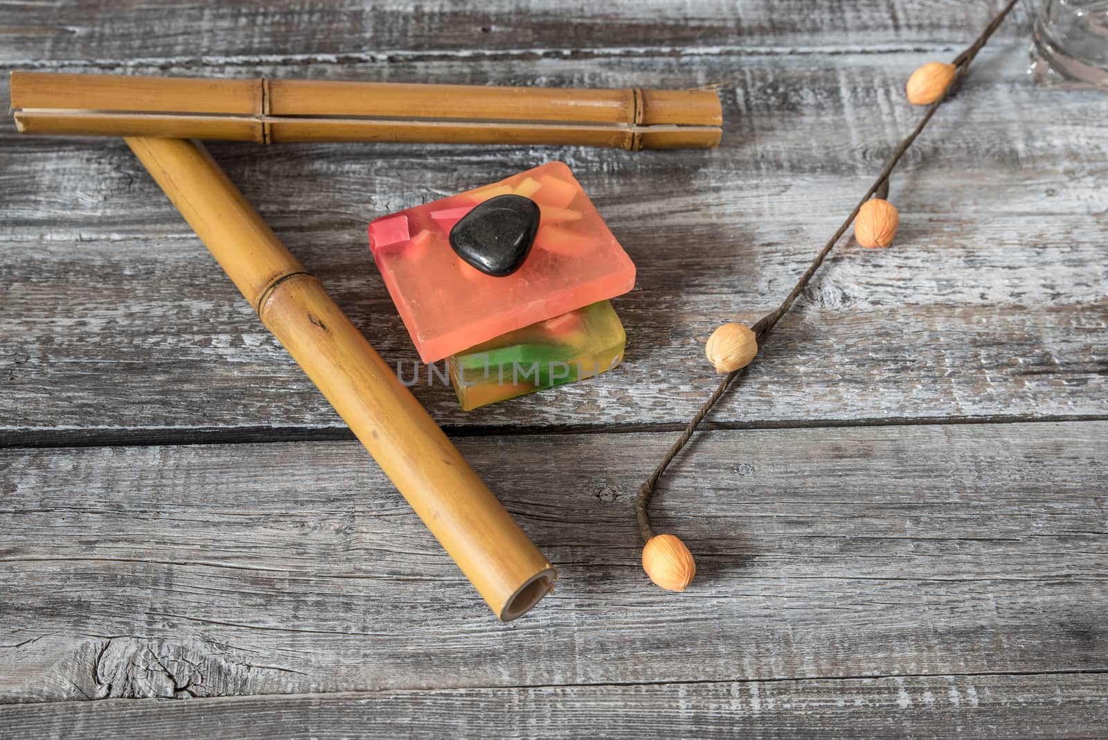 Spa concept. aromatic soaps and bamboo sticks on wooden background