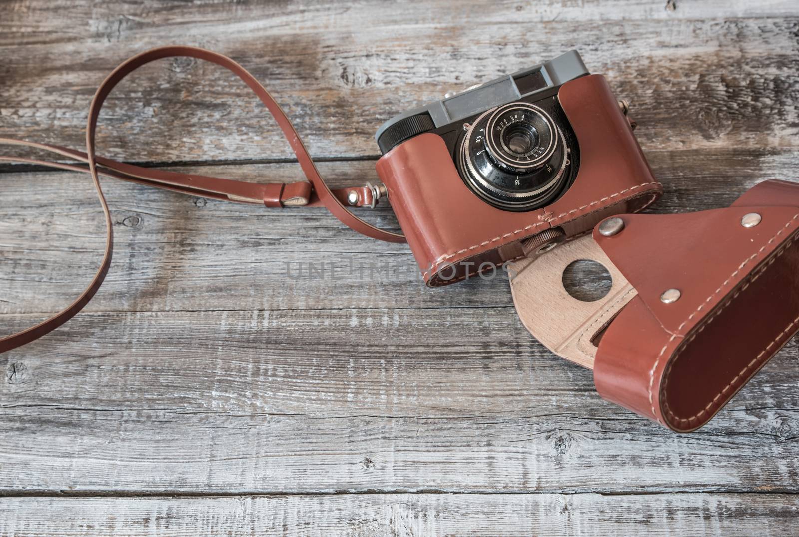 Vintage  old camera on wood background.Top view