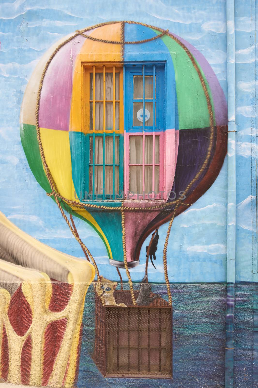 Colourful murals decorating the walls of buildings in the historic port city of Valparaiso in Chile.