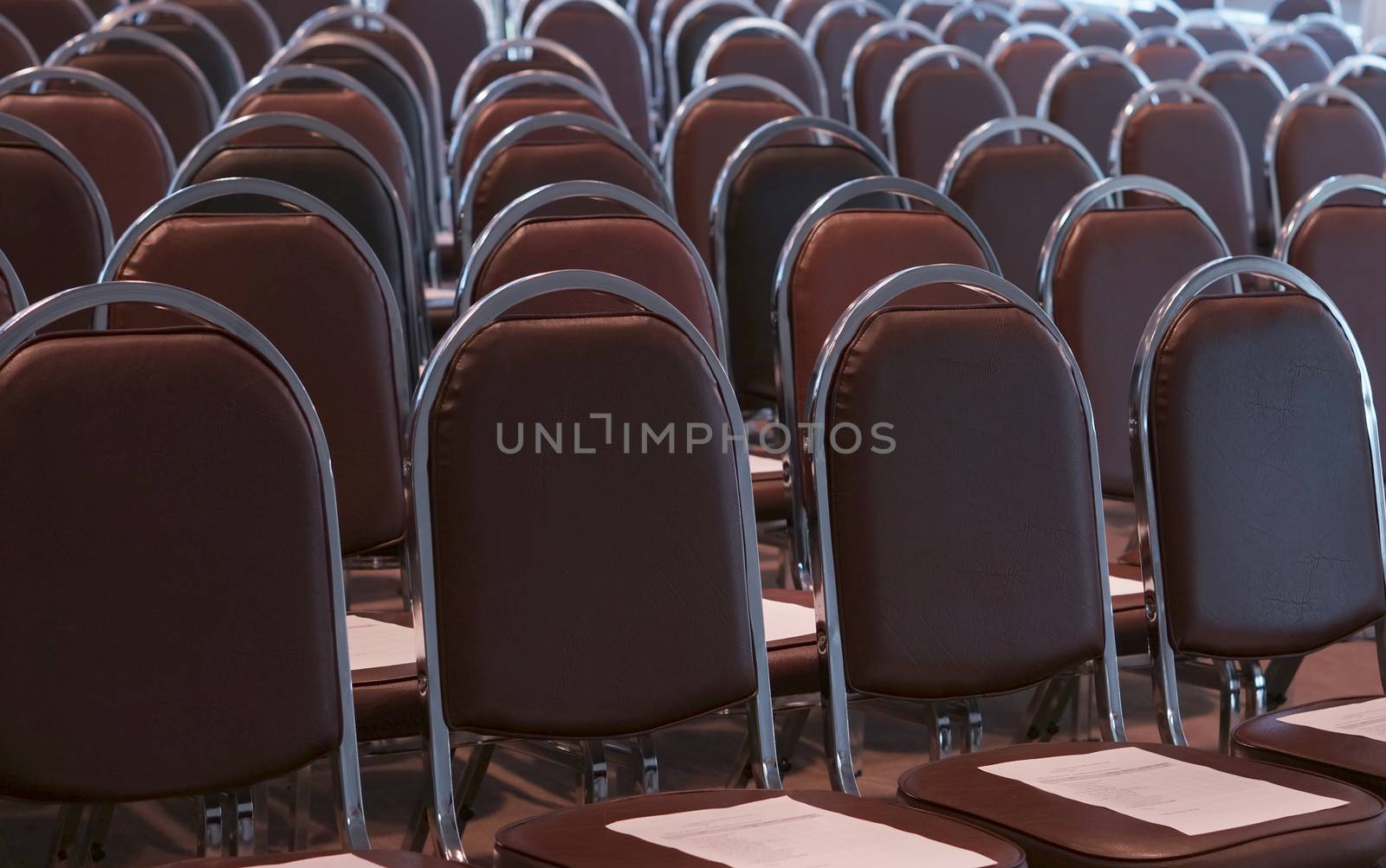 Chair in conference room was prepared at lobby in building.