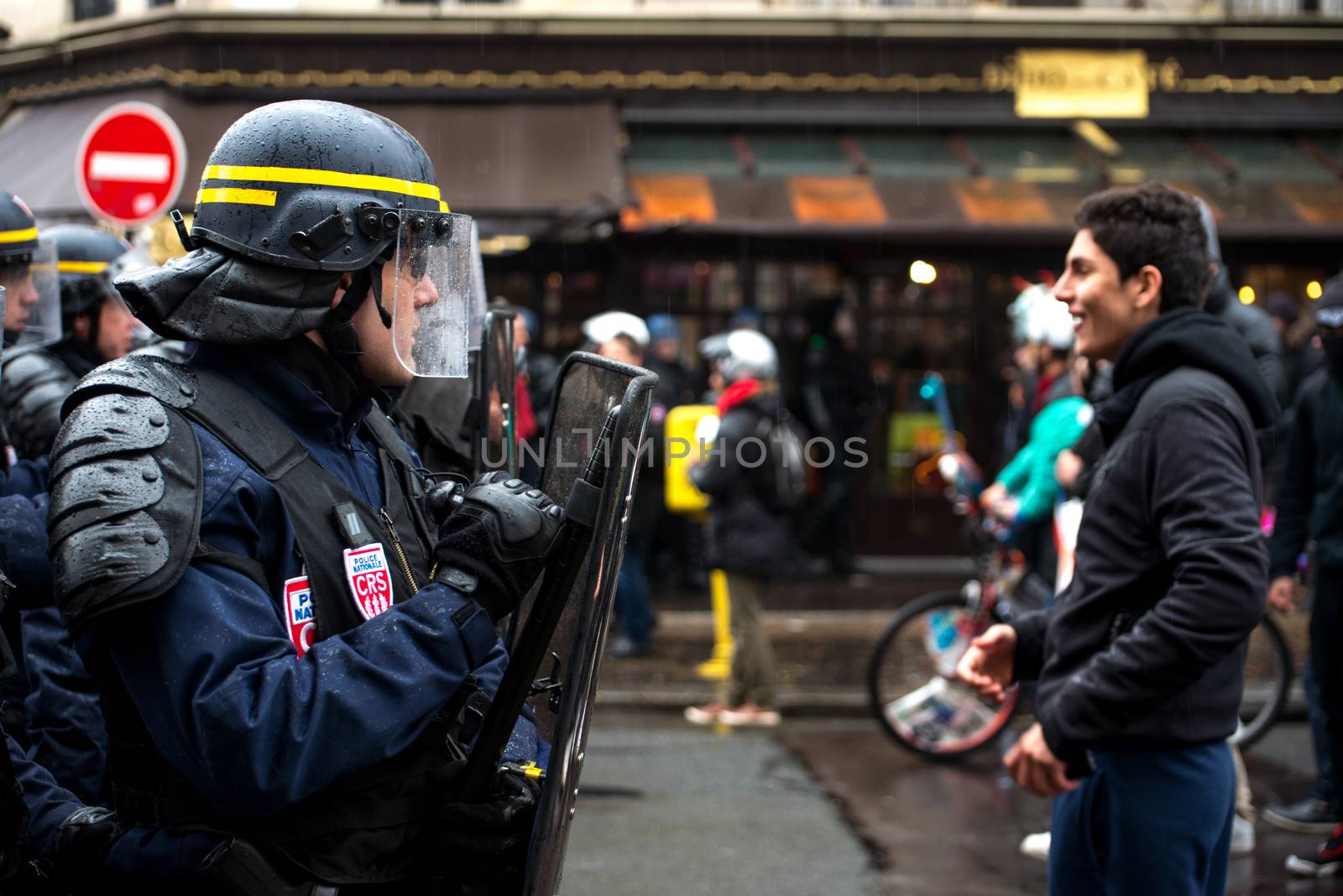 FRANCE, Paris: French riot police officers stand in line as thousands demonstrate against the French government's planned labour law reforms on March 31, 2016 in Paris. France faced fresh protests over labour reforms just a day after the beleaguered government of President Francois Hollande was forced into an embarrassing U-turn over constitutional changes.