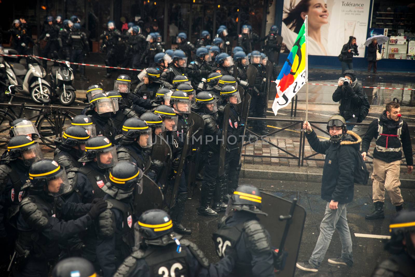 FRANCE, Paris: French riot police officers stand in line as thousands demonstrate against the French government's planned labour law reforms on March 31, 2016 in Paris. France faced fresh protests over labour reforms just a day after the beleaguered government of President Francois Hollande was forced into an embarrassing U-turn over constitutional changes.