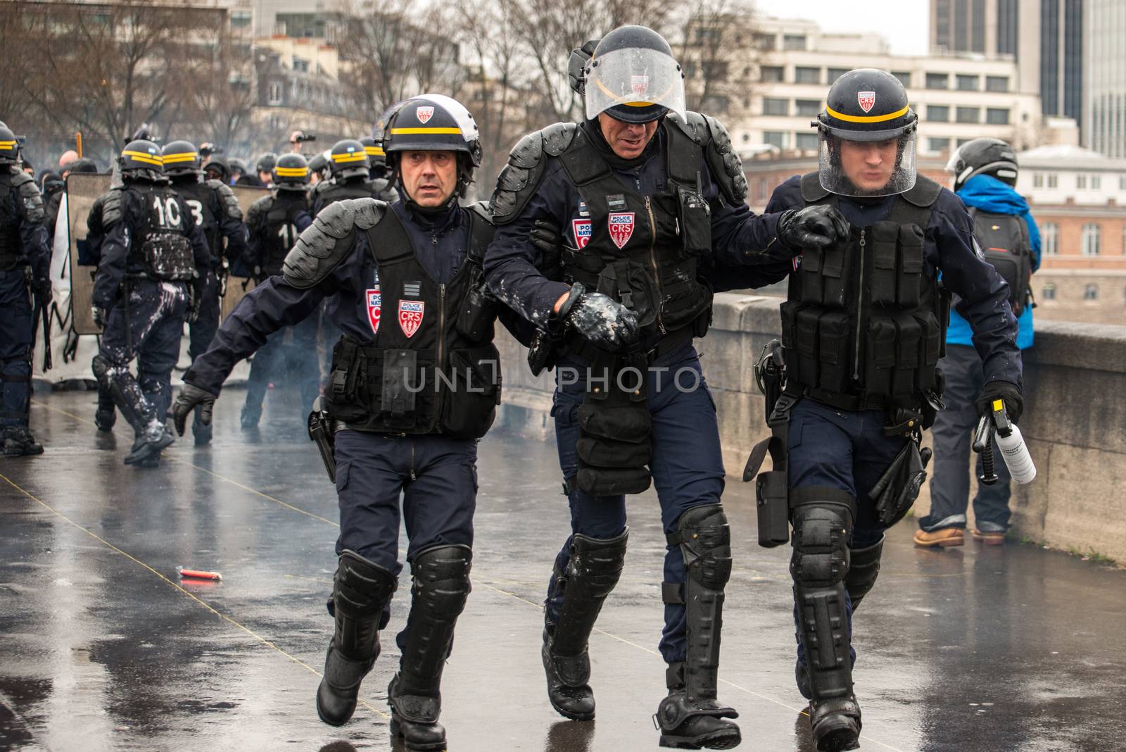 FRANCE, Paris: French riot police officers retreat after clashes with protesters, as thousands demonstrate against the French government's planned labour law reforms on March 31, 2016 in Paris. France faced fresh protests over labour reforms just a day after the beleaguered government of President Francois Hollande was forced into an embarrassing U-turn over constitutional changes.