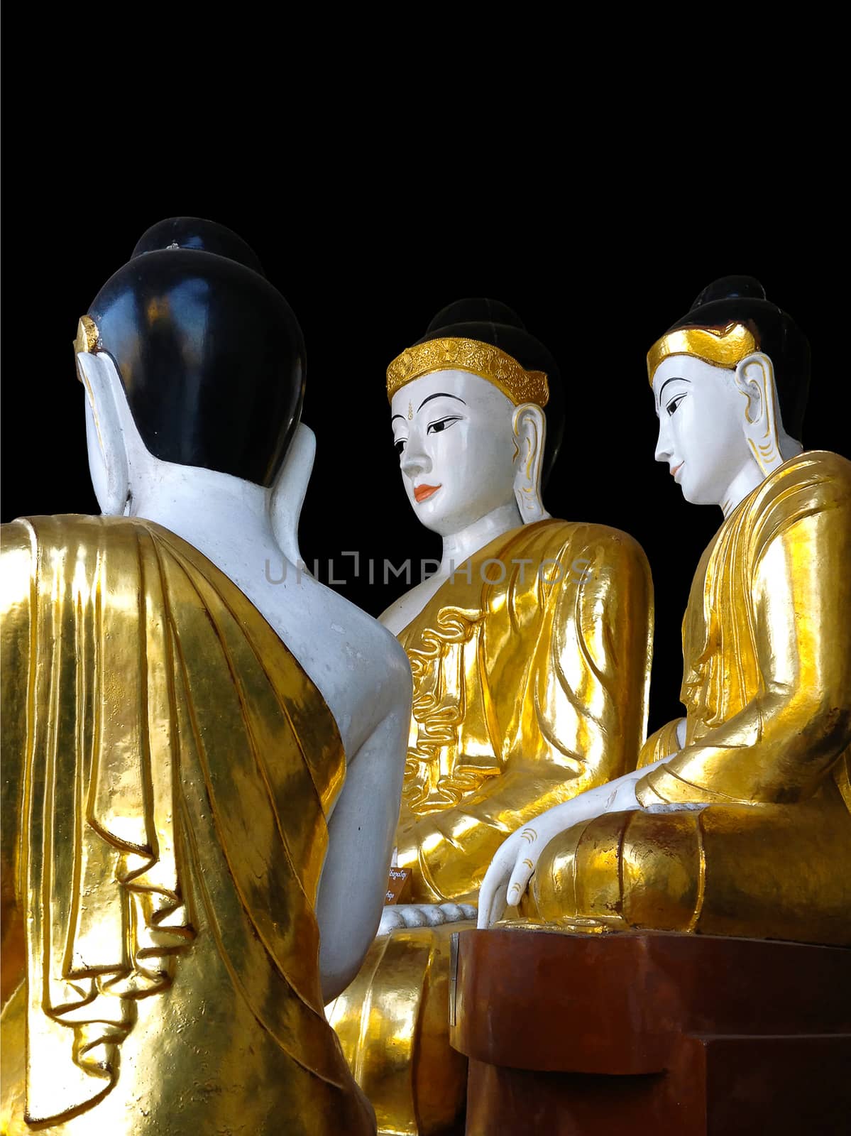 Gold and white Buddha statues at the Shwedagon Pagoda in Yangon, Myanmar (Black background)