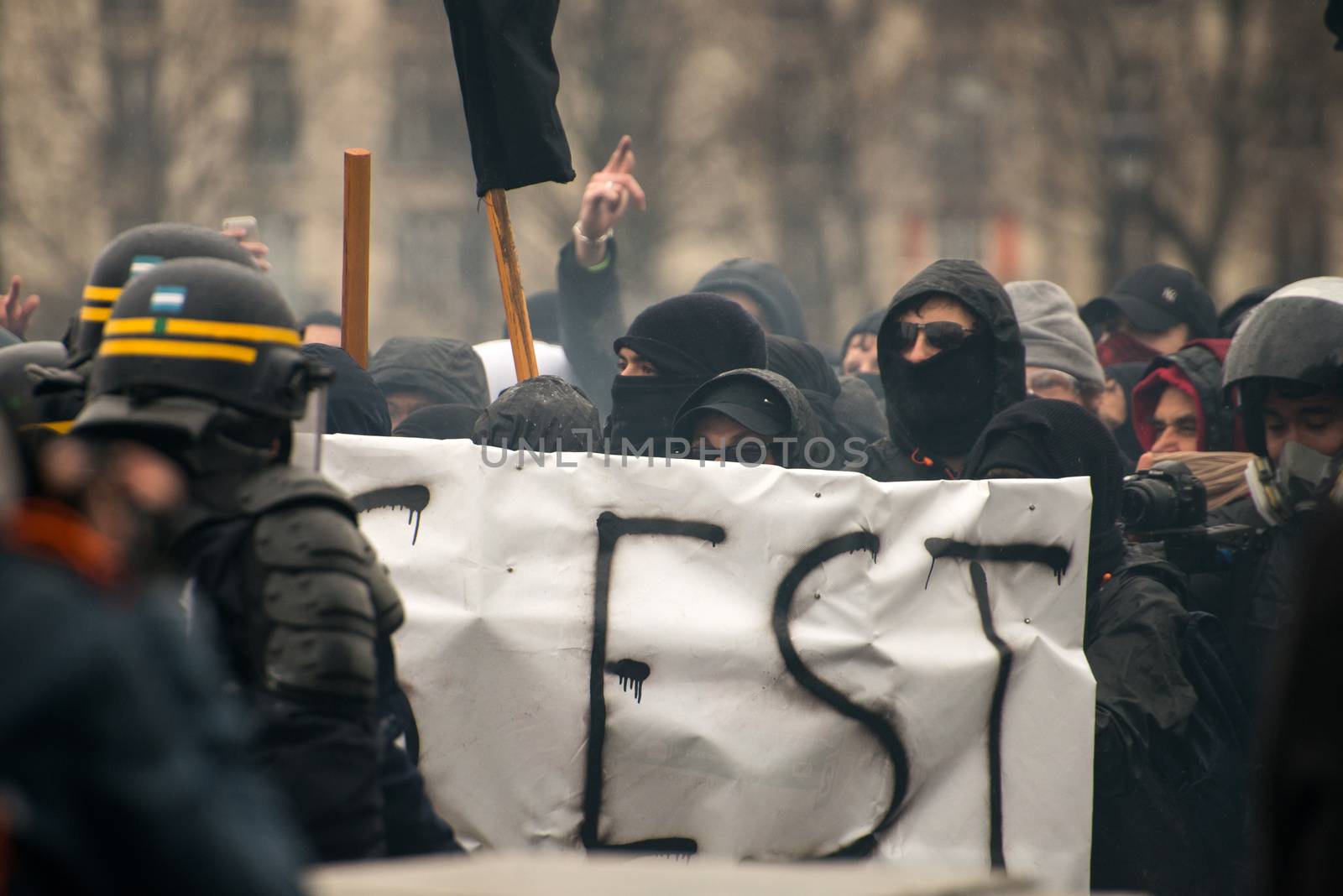 FRANCE, Paris: Protesters clash with French riot police officers as thousands demonstrate against the French government's planned labour law reforms on March 31, 2016 in Paris. France faced fresh protests over labour reforms just a day after the beleaguered government of President Francois Hollande was forced into an embarrassing U-turn over constitutional changes. 