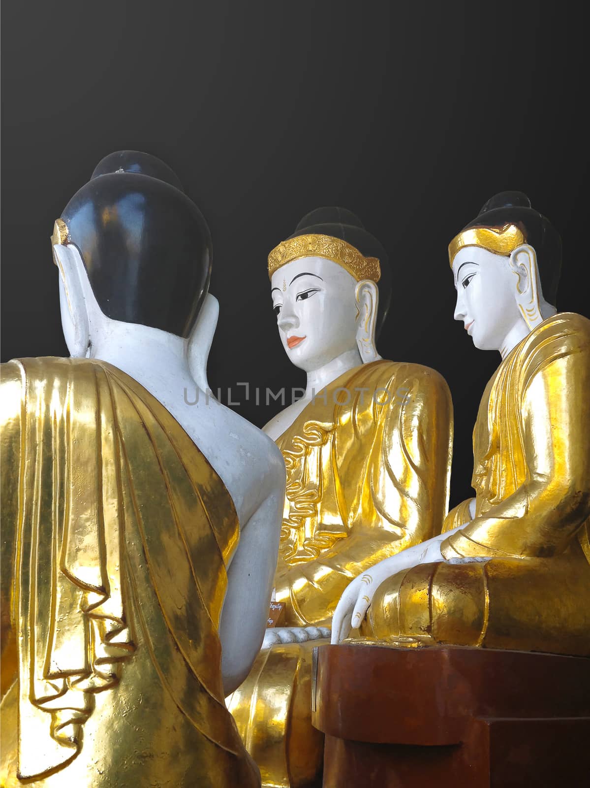 Gold and white Buddha statues at the Shwedagon Pagoda in Yangon, Myanmar