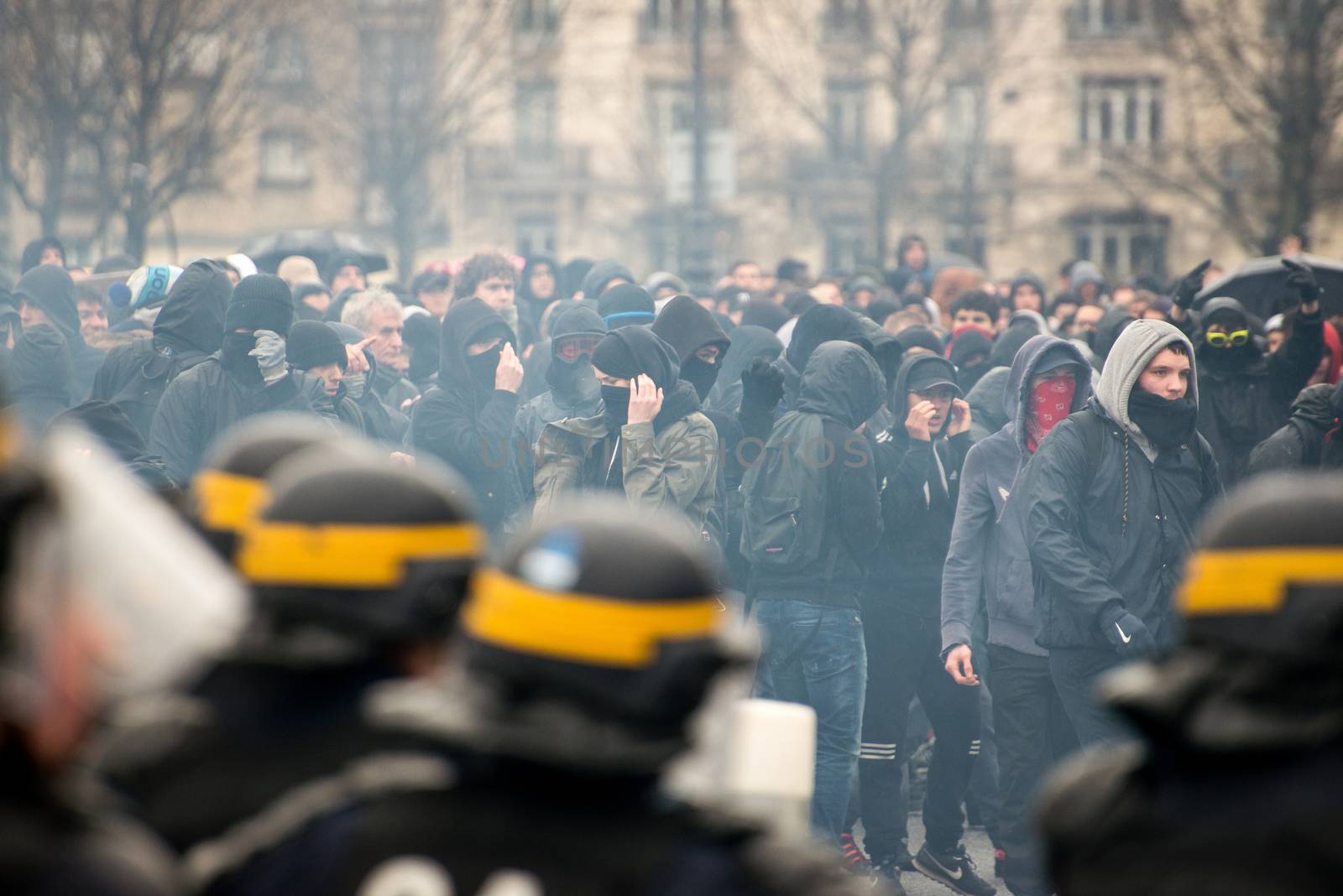 FRANCE, Paris: Protesters clash with French riot police officers as thousands demonstrate against the French government's planned labour law reforms on March 31, 2016 in Paris. France faced fresh protests over labour reforms just a day after the beleaguered government of President Francois Hollande was forced into an embarrassing U-turn over constitutional changes. 