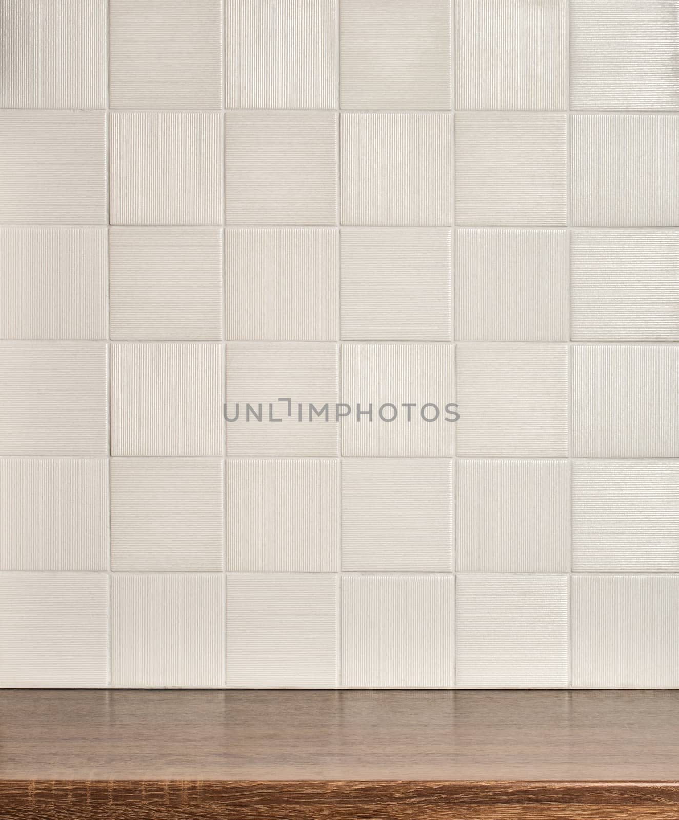Empty wooden table in the kitchen, tile white wall