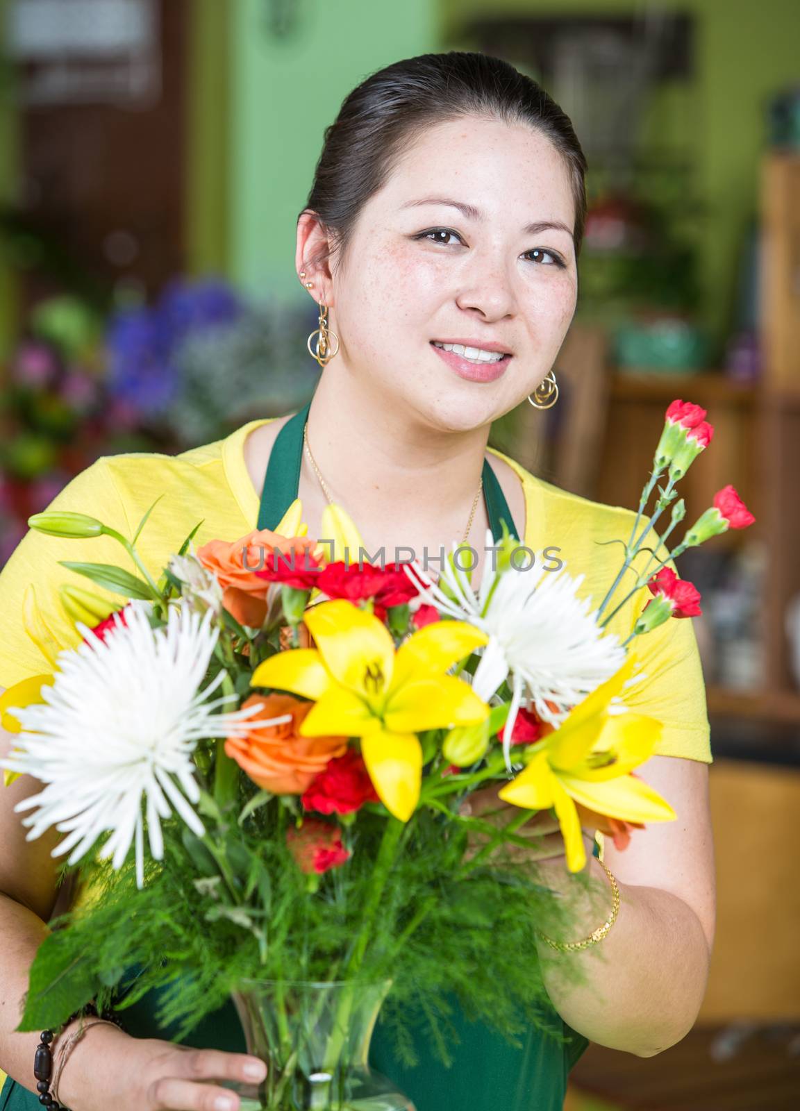 Flower Shop Worker Creating Arrangement by Creatista