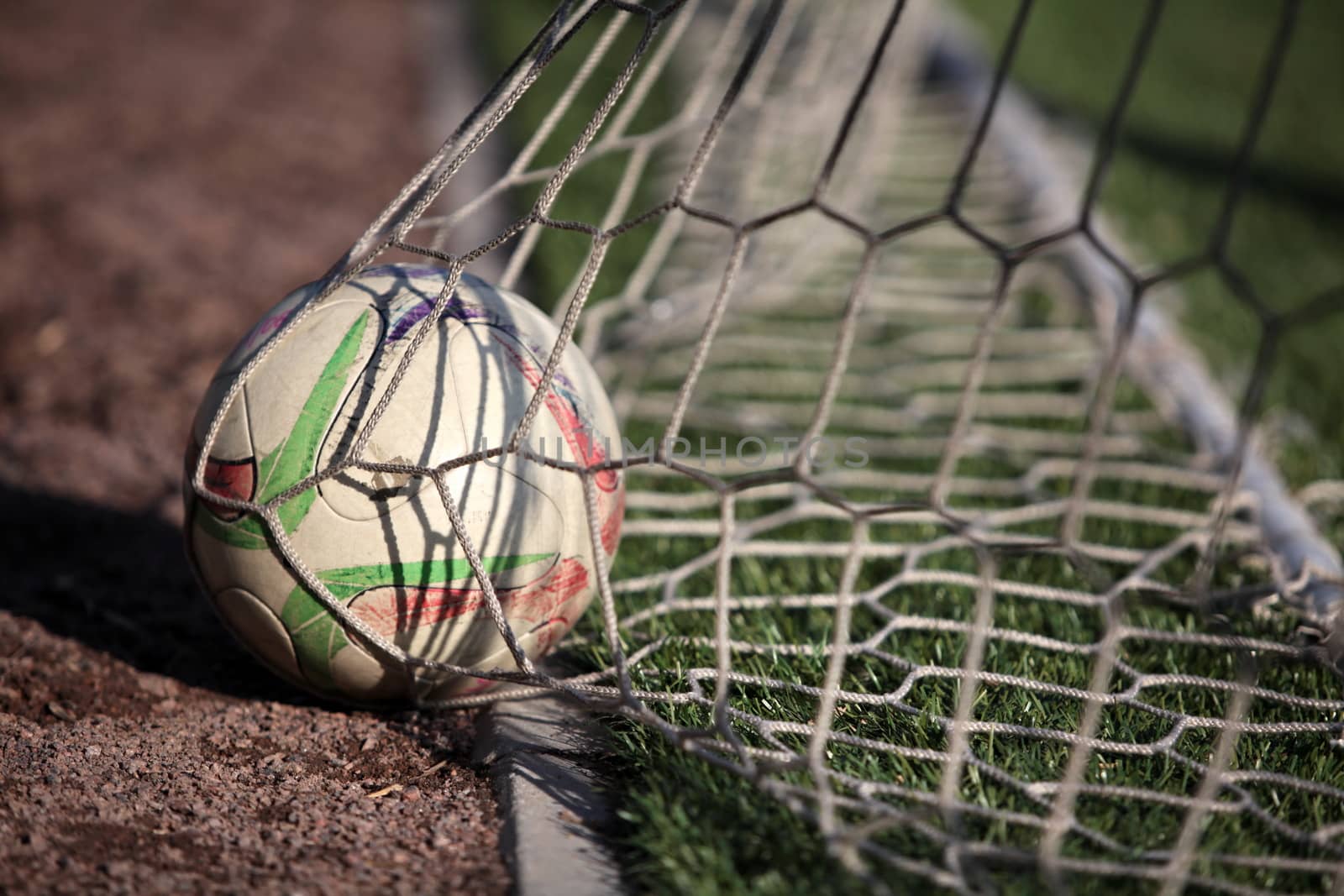 football ball scored into the net gate