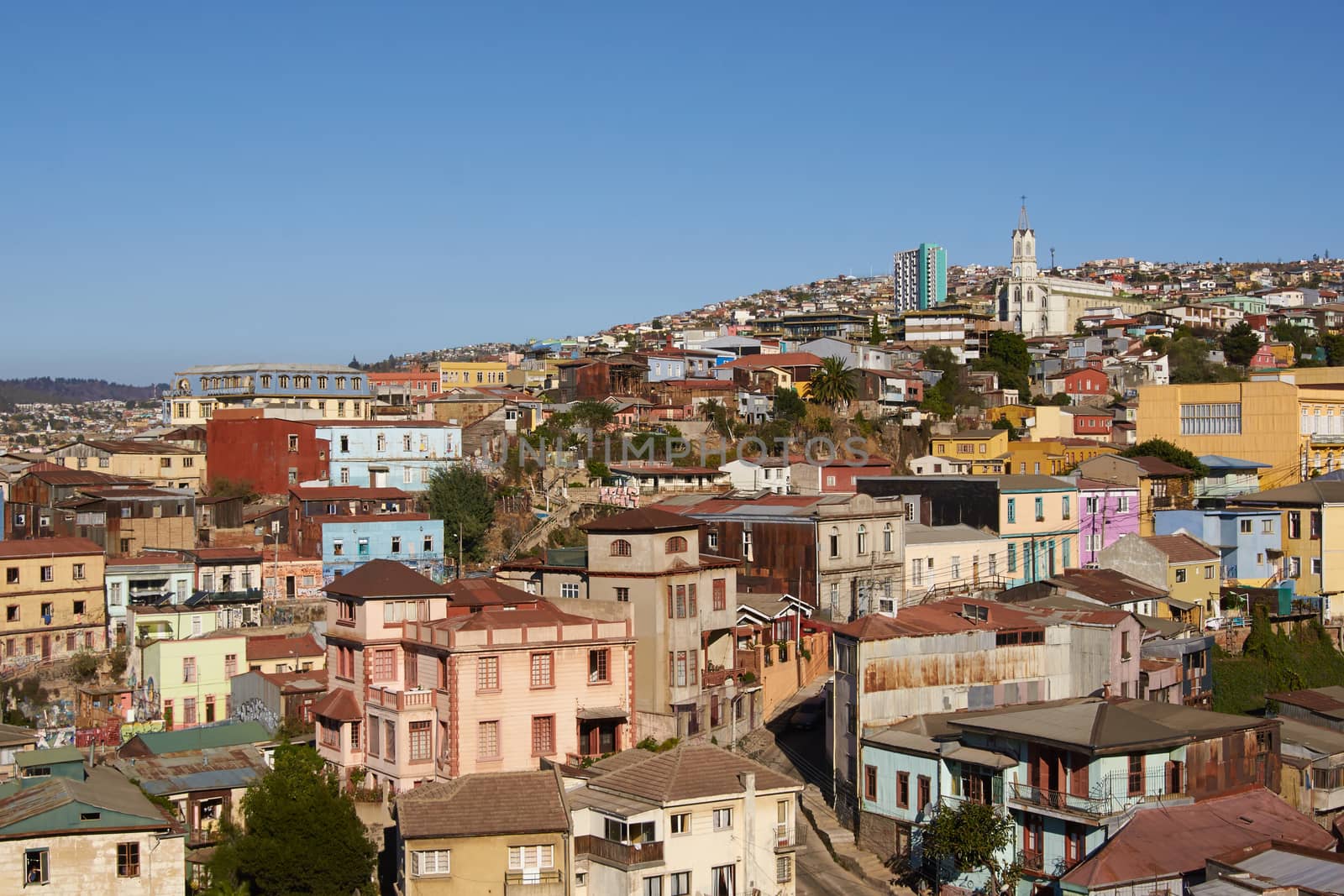 Colourfully decorated houses crowd the hillsides of the historic port city of Valparaiso in Chile.