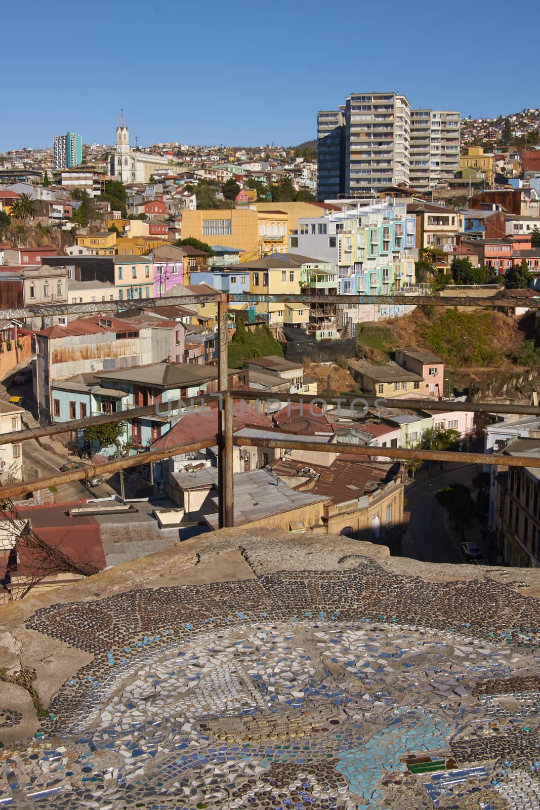 Colourfully decorated houses crowd the hillsides of the historic port city of Valparaiso in Chile.